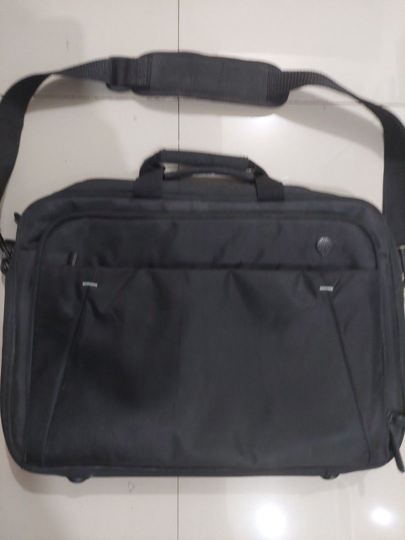 HP Laptop Bag with Shoulder Strap (Category: Laptop Bags & Sleeves) located in Mandaluyong City. Submitted by derekalava (Listing ID 1419757851, Image 1). Description: - Black HP laptop bag - Includes shoulder strap and handle - Multiple compartments for storage - Padded section for laptop protection - Features HP logo - Secure zipper closure - Made of durable material.