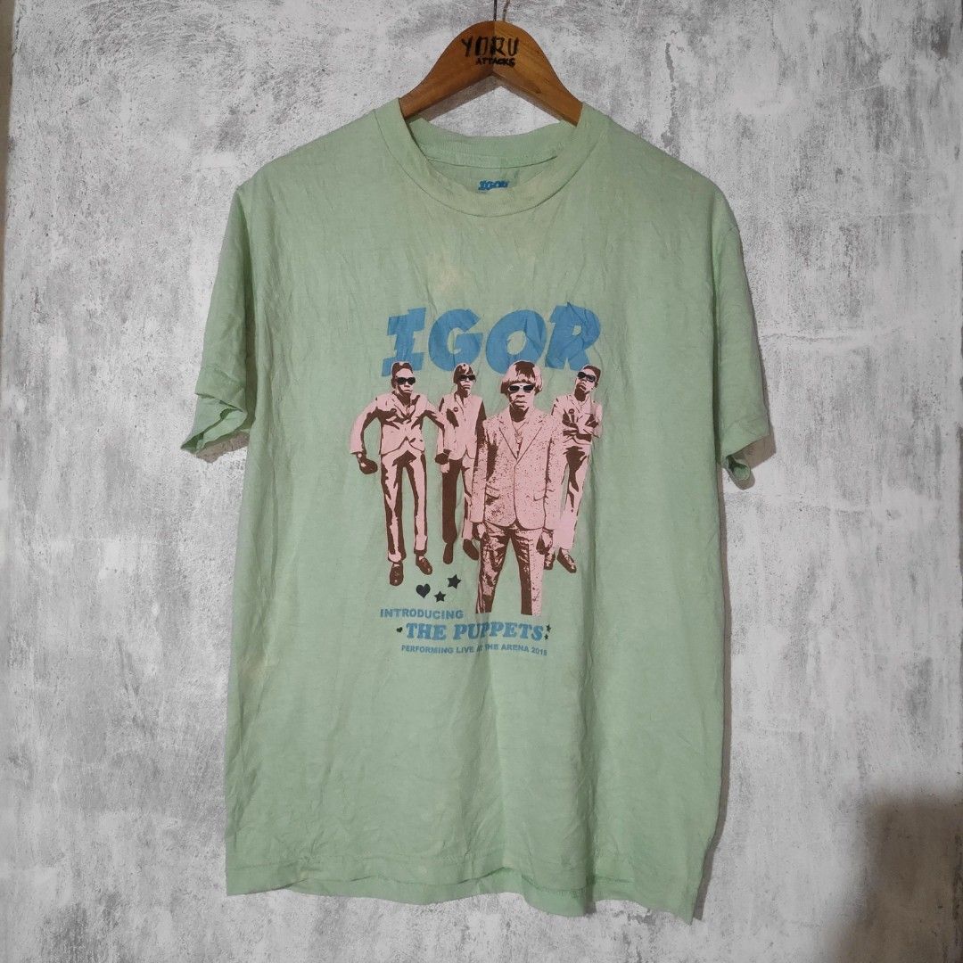 Igor The Puppets T-Shirt (Category: Tshirts & Polo Shirts ) located in Masbate. Submitted by ydruattacks (Listing ID 1419751159, Image 1). Description: - Igor T-shirt - Features "The Puppets" design - Color: Light Green - Size: Medium - Material: 100% Cotton - Neckline: Crew Neck - Sleeve Length: Short Sleeves - Made in Mexico by Golf Wang - 20W x 27L - Issue: Bleach stain on front part.