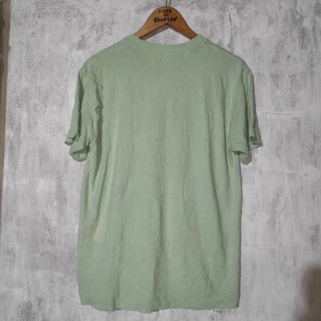 Igor The Puppets T-Shirt (Category: Tshirts & Polo Shirts ) located in Masbate. Submitted by ydruattacks (Listing ID 1419751159, Image 2). Description: - Igor T-shirt - Features "The Puppets" design - Color: Light Green - Size: Medium - Material: 100% Cotton - Neckline: Crew Neck - Sleeve Length: Short Sleeves - Made in Mexico by Golf Wang - 20W x 27L - Issue: Bleach stain on front part.