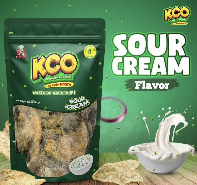 KCO Kangkong Chips Original - Various Flavors (Category: Packaged & Instant Food) located in Manila. Submitted by wiseshark-d8f6 (Listing ID 1419651918, Image 2). Description: - KCO Kangkong Chips: Delicious and crunchy water spinach chips. - Available Flavors: Classic, Cheese, BBQ, Sour Cream, Chocolate, Spicy, Salt N' Vinegar, Spicy Cheese. - Each pack: 100g. - Perfect for snacking or sharing. - Made by Josh Mojica..