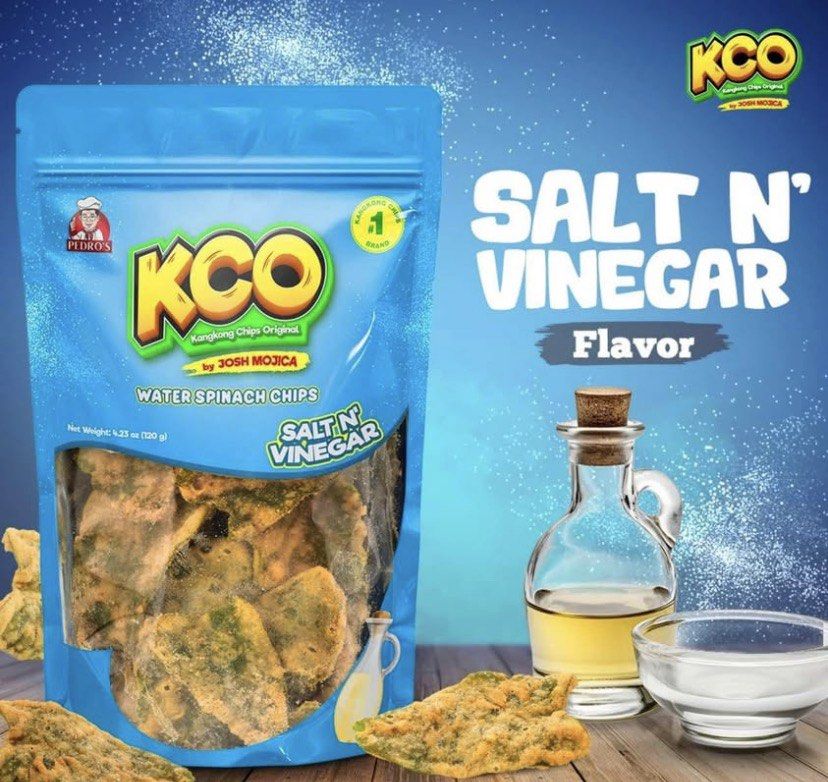 KCO Kangkong Chips Original - Various Flavors (Category: Packaged & Instant Food) located in Manila. Submitted by wiseshark-d8f6 (Listing ID 1419651918, Image 3). Description: - KCO Kangkong Chips: Delicious and crunchy water spinach chips. - Available Flavors: Classic, Cheese, BBQ, Sour Cream, Chocolate, Spicy, Salt N' Vinegar, Spicy Cheese. - Each pack: 100g. - Perfect for snacking or sharing. - Made by Josh Mojica..