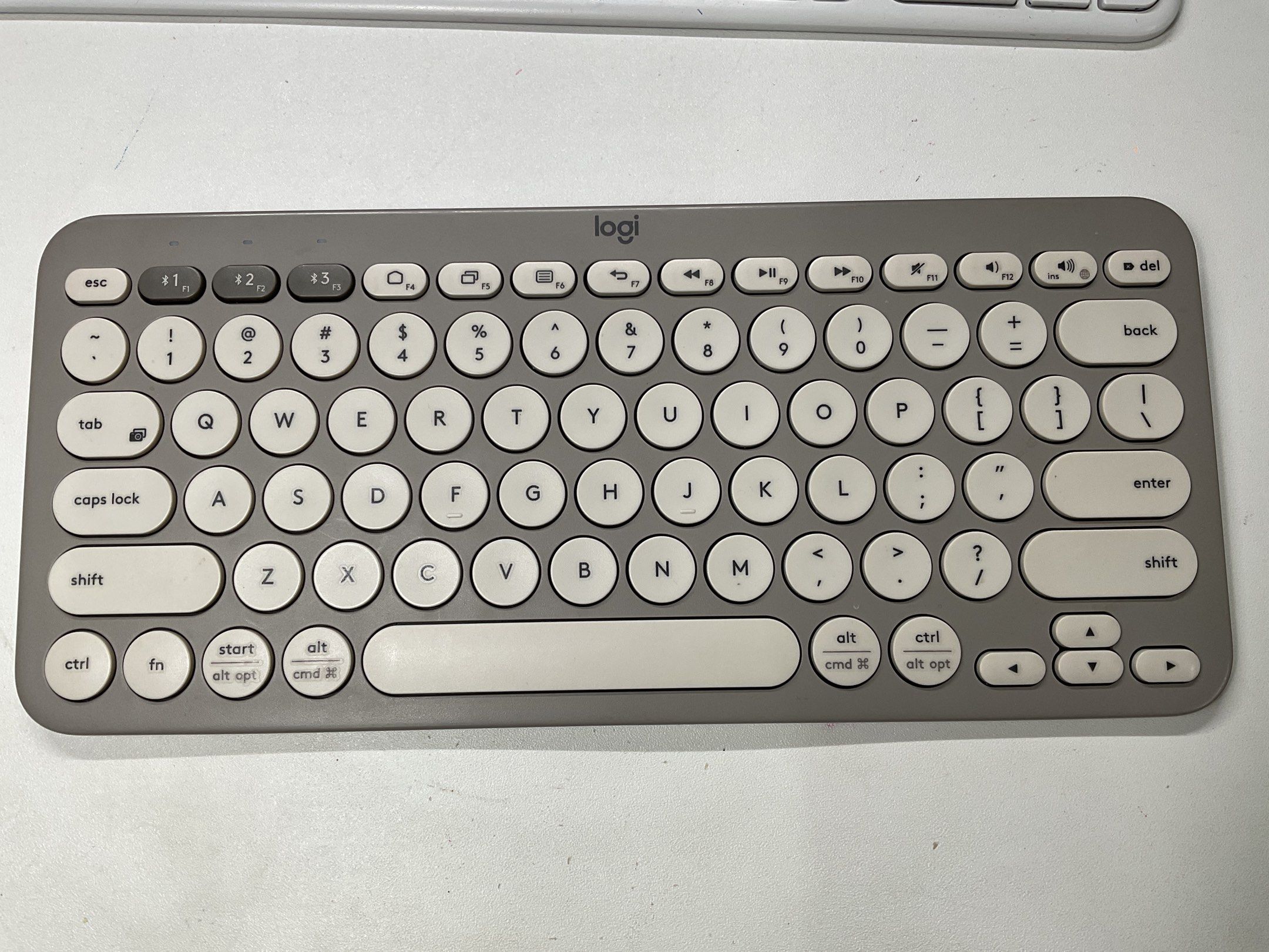 Logitech K380 (Category: Computer Keyboard) located in Ipoh. Submitted by ostracioncubicus (Listing ID 1419749021, Image 1). Description: Model: Logitech K380 Connectivity: Bluetooth 3 devices, Supports: Windows / iOS Batteries: AAA x 2pcs Colour: Grey / Sand Reason for selling: No number pad Condition: Seldom used, clean, No box, no warranty. Deal method: Best if you can bring your device to test before you buy. .