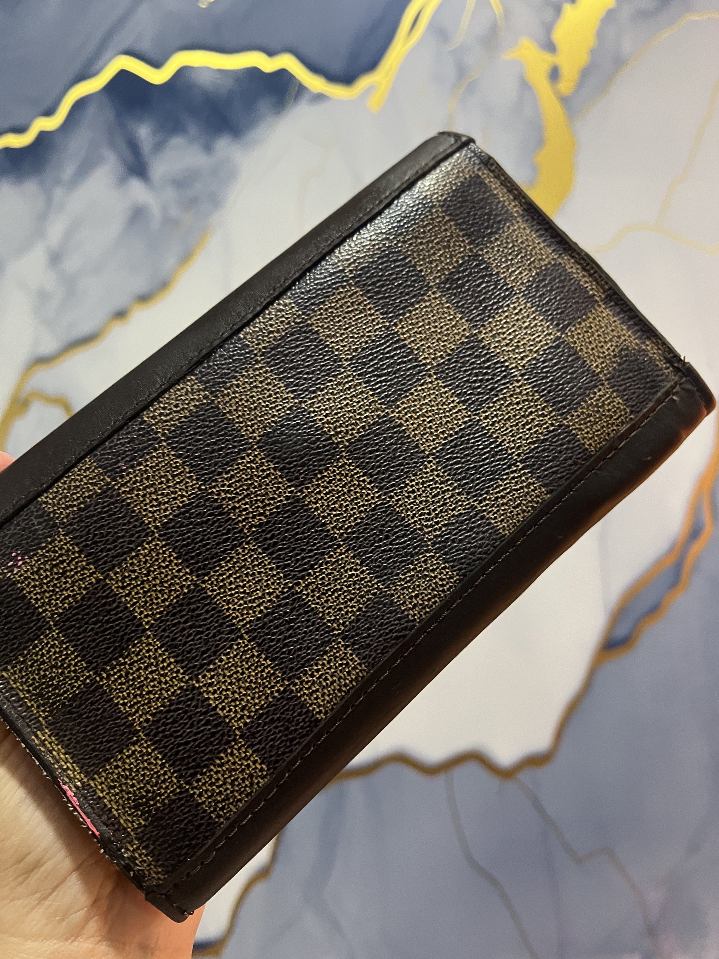 Louis Vuitton Damier Ebene Wallet Authentic (Category: Luxury Bags & Wallets) located in Bulacan. Submitted by gcdeclutters_malolosbulacan (Listing ID 1419612002, Image 3). Description: - Authentic Louis Vuitton Damier Ebene wallet - Project - As Is Where Is - Edges repaired with original vachetta leather - Iconic Damier Ebene canvas exterior - Brown leather trim - Multiple card slots and compartments - Snap closure - Brown textile interior linin