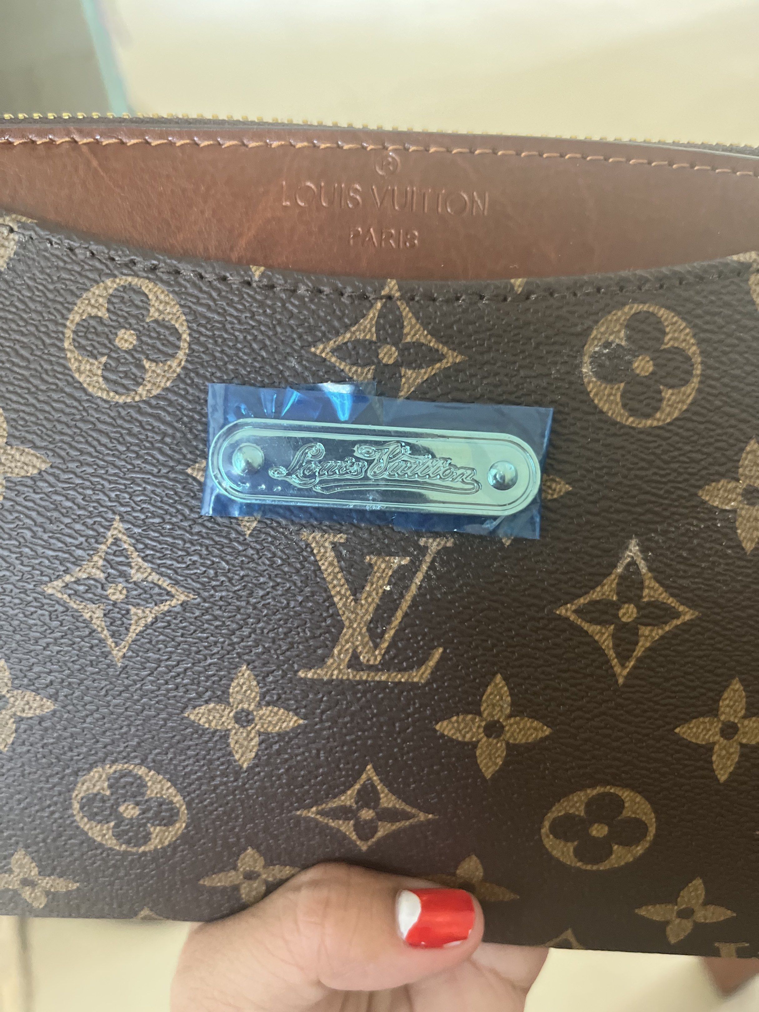 Louis Vuitton Monogram Clutch (Category: Luxury Bags & Wallets) located in Daanbantayan. Submitted by christinet58475 (Listing ID 1419654099, Image 2). Description: - Louis Vuitton clutch - Classic monogram canvas - Zip closure - Interior pockets - Detachable strap - Includes dust bag - Brown leather lining - Gold-tone hardware - Made in France.