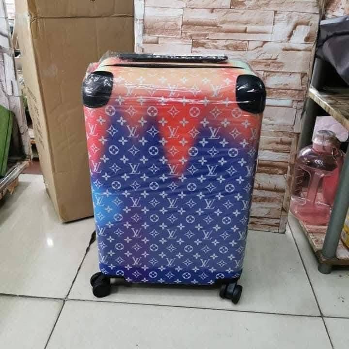 Louis Vuitton Rolling Suitcase (Category: Luxury Bags & Wallets) located in Manila. Submitted by louievicocollections (Listing ID 1419632926, Image 1). Description: - Louis Vuitton Monogram rolling suitcase - Features a stylish gradient color design - Medium size, perfect for travel - Equipped with a convenient retractable handle - Smooth maneuverability with four wheels - Durable construction with reinforced corners - Wrapped in protective plast
