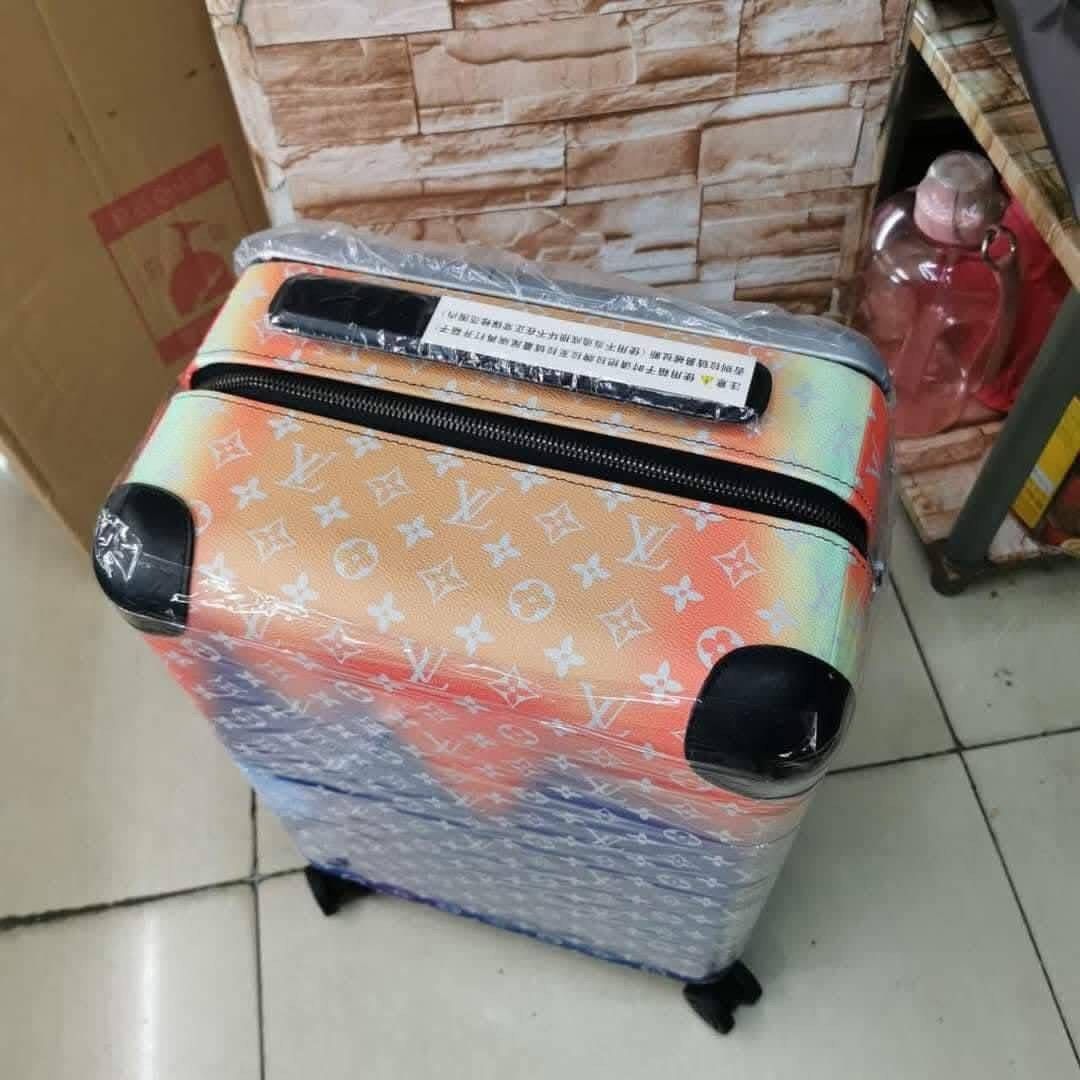 Louis Vuitton Rolling Suitcase (Category: Luxury Bags & Wallets) located in Manila. Submitted by louievicocollections (Listing ID 1419632926, Image 3). Description: - Louis Vuitton Monogram rolling suitcase - Features a stylish gradient color design - Medium size, perfect for travel - Equipped with a convenient retractable handle - Smooth maneuverability with four wheels - Durable construction with reinforced corners - Wrapped in protective plast