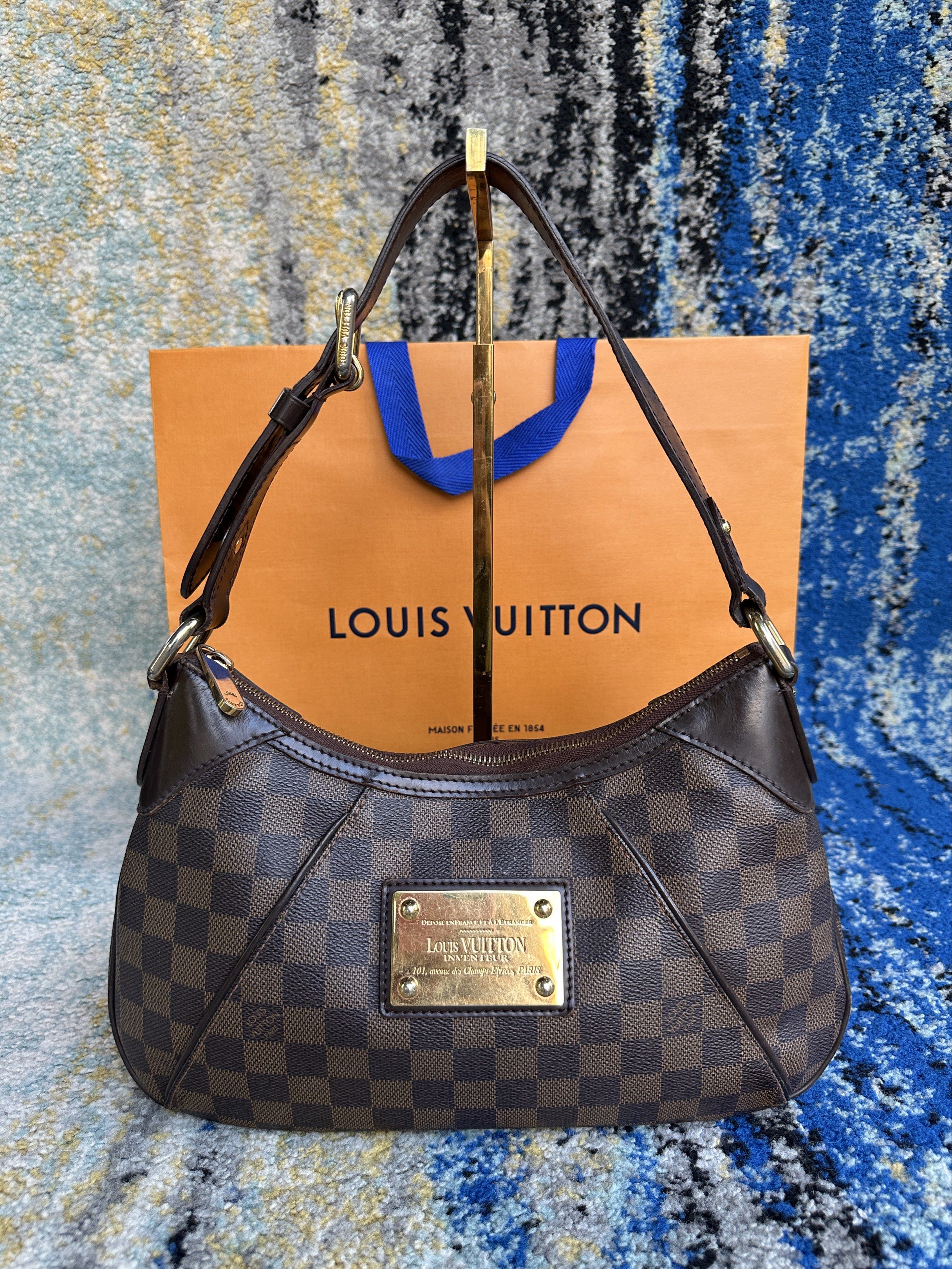 Louis Vuitton Thames Damier Ebene (Category: Luxury Bags & Wallets) located in Paranaque City. Submitted by changingclassic (Listing ID 1419629545, Image 1). Description: -Louis Vuitton Thames Damier Ebene - Authentic 💯 -With entrupy - Classic shoulder bag design. - Spacious interior you can put many things - I can send video for the condition -Slightly nego Dm for Interested.