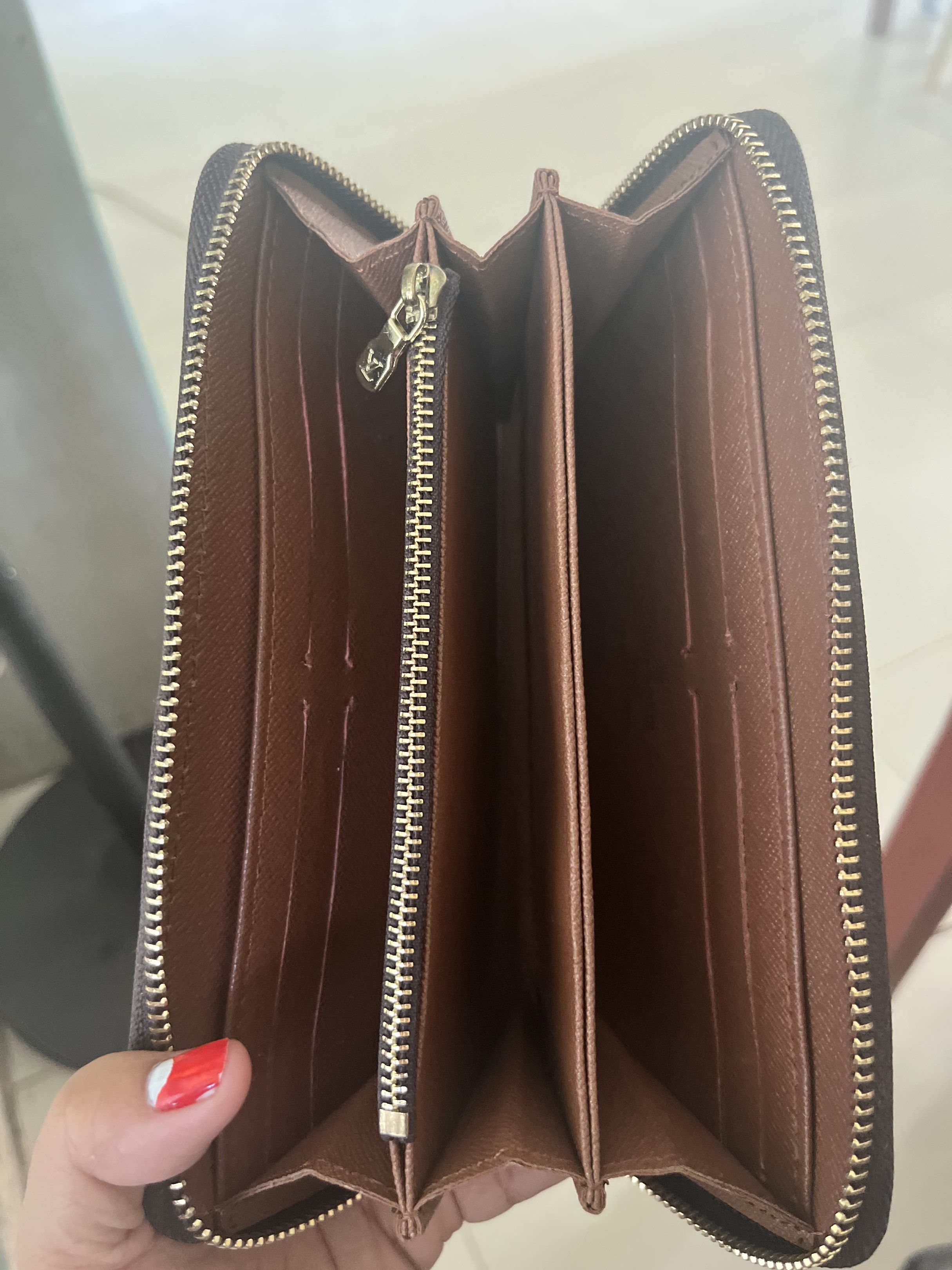 Louis Vuitton Zippy Wallet (Category: Luxury Bags & Wallets) located in Daanbantayan. Submitted by christinet58475 (Listing ID 1419653081, Image 3). Description: - Louis Vuitton Zippy Wallet - Iconic Monogram canvas exterior - Multiple card slots and compartments - Secure zip-around closure - Elegant gold-toned hardware - Made in France.