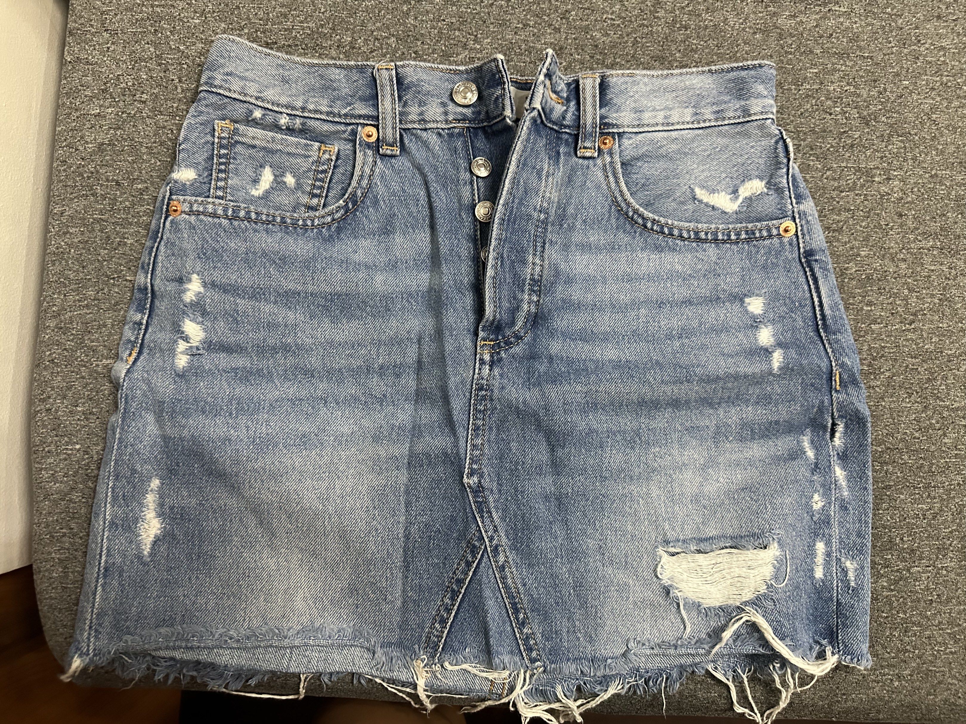 MANGO Denim Skirt (Category: Skirts) located in Manila. Submitted by ryryrys (Listing ID 1419658028, Image 1). Description: - MNG denim skirt - Light blue color - Size: XS - Button closure - Distressed detailing - Classic five-pocket design - Made in Pakistan.