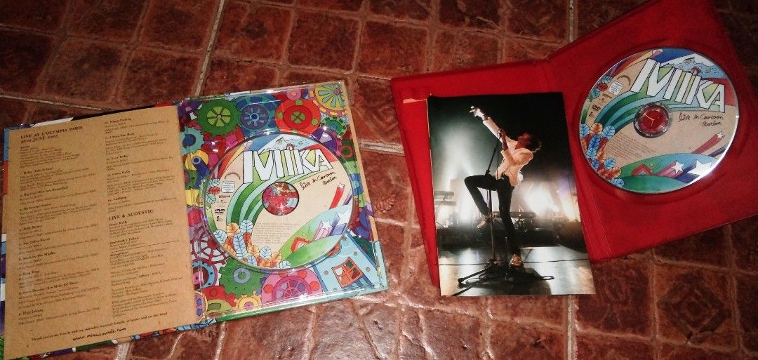 MIKA Live in Cartoon Motion DVD (Category: CDs & DVDs) located in Quezon City. Submitted by dancatz (Listing ID 1419597518, Image 2). Description: - MIKA "Live in Cartoon Motion" DVD - Features live performances from Olympia Paris - Includes bonus features, a booklet, and a photo - Available in two versions: • P250.00 Philippines ( water damage on cover sleeve ) • P350.00 U.K. - Includes songs like: "Relax, Take It Easy", "Big Girl (You Are Beaut