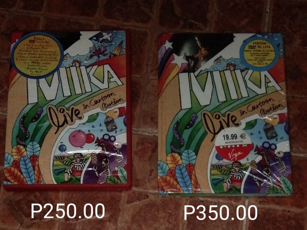 MIKA Live in Cartoon Motion DVD (Category: CDs & DVDs) located in Quezon City. Submitted by dancatz (Listing ID 1419597518, Image 1). Description: - MIKA "Live in Cartoon Motion" DVD - Features live performances from Olympia Paris - Includes bonus features, a booklet, and a photo - Available in two versions: • P250.00 Philippines ( water damage on cover sleeve ) • P350.00 U.K. - Includes songs like: "Relax, Take It Easy", "Big Girl (You Are Beaut