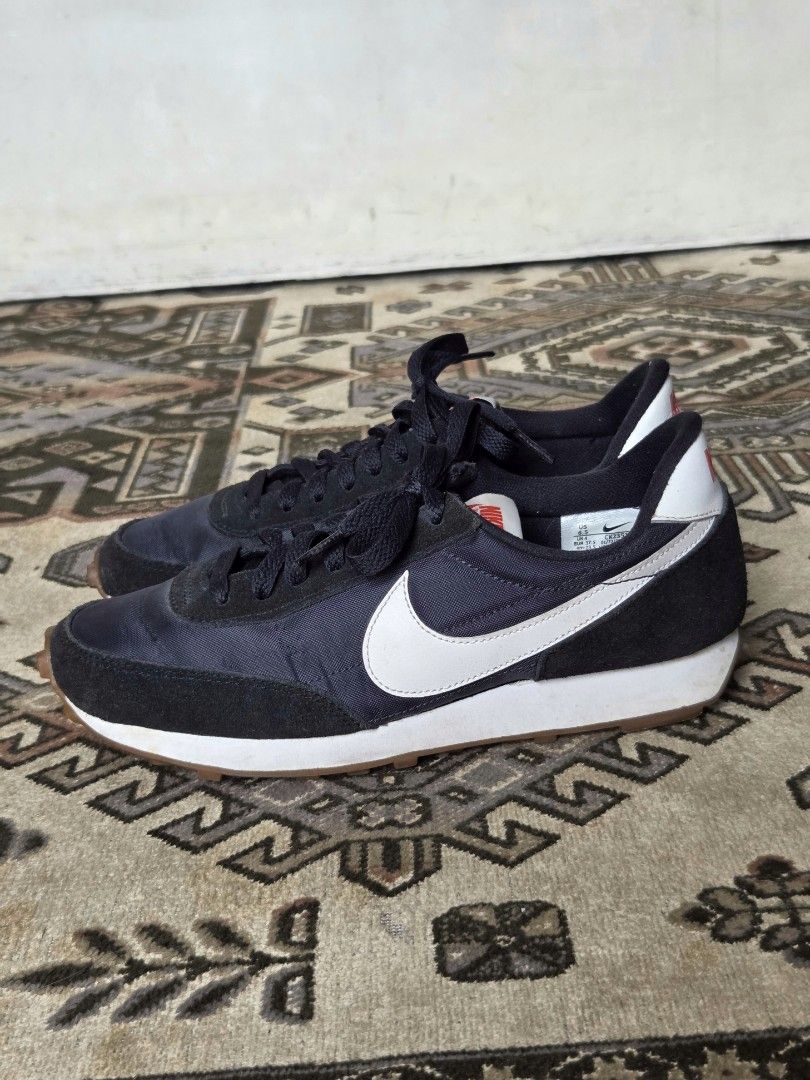 Nike Daybreak Waffle Trainer 2 (Category: Sneakers) located in Manila. Submitted by didst (Listing ID 1419605528, Image 1). Description: - Nike Daybreak Waffle Trainer 2 - Black with white and red accents - White Nike swoosh - Brown waffle soles - Black laces.