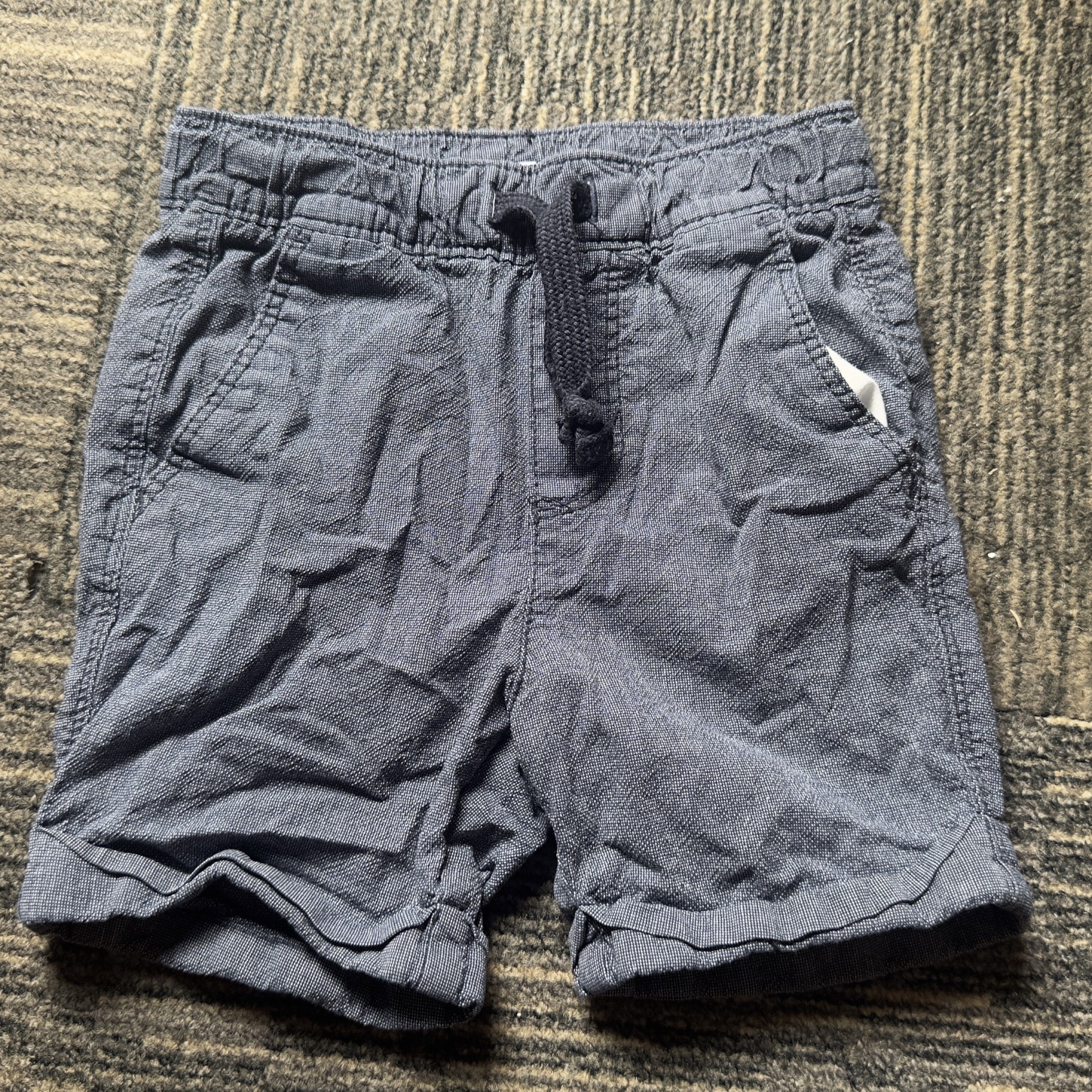 Old Navy Toddler Stretch Shorts 2 Years Old (Category: Babies & Kids Fashion) located in Angeles City. Submitted by gladnovic10 (Listing ID 1419633174, Image 1). Description: - Old Navy shorts - Size: 2T - Color: Dark blue - Material: Stretch 98% Cotton 2% Elastane - Features: Elastic waistband with drawstring, two front pockets, one back pocket.