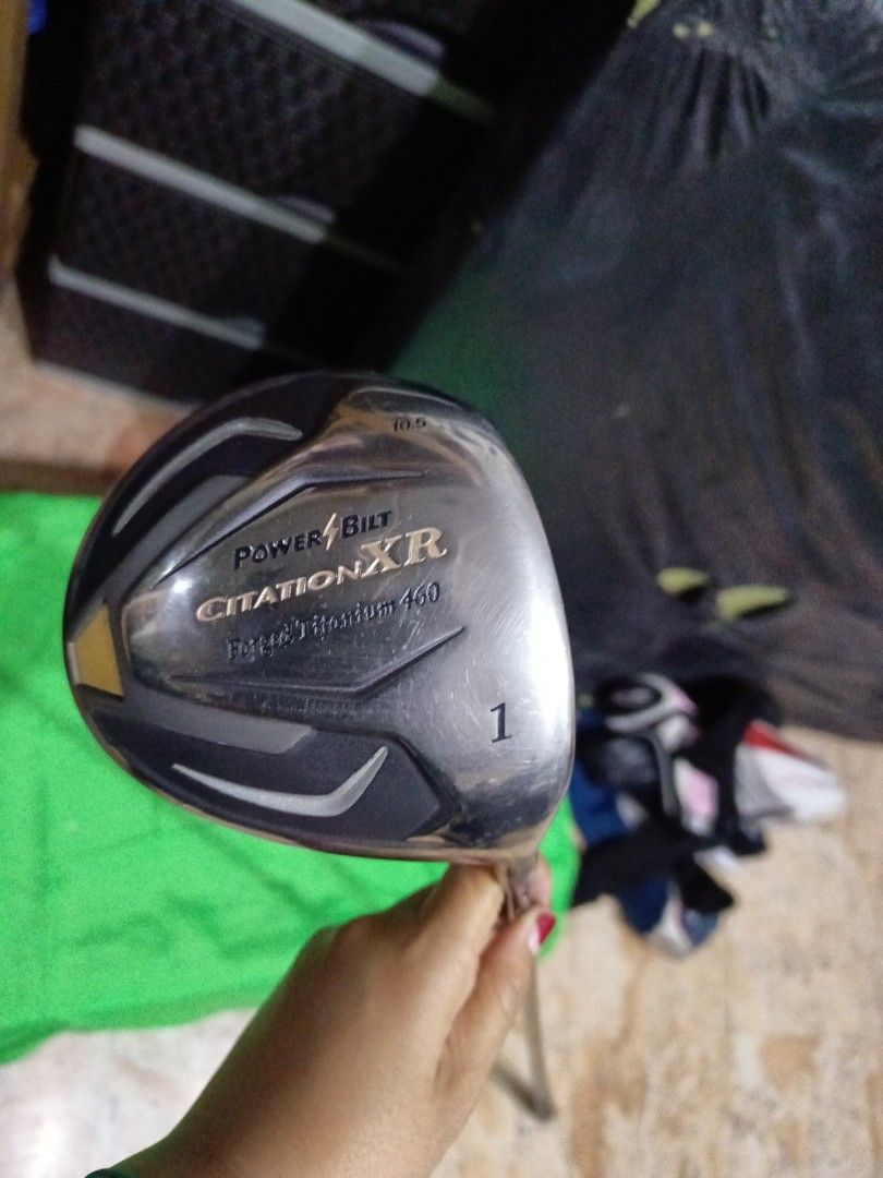 PowerBilt Citation XR Driver (Category: Golf) located in Manila. Submitted by yeonmei5614747 (Listing ID 1419640533, Image 1). Description: - PowerBilt Citation XR driver - Titanium face - 460cc head - Black shaft with PowerBilt branding - Black, textured grip - Silver and black club head design - Number "1" on top.