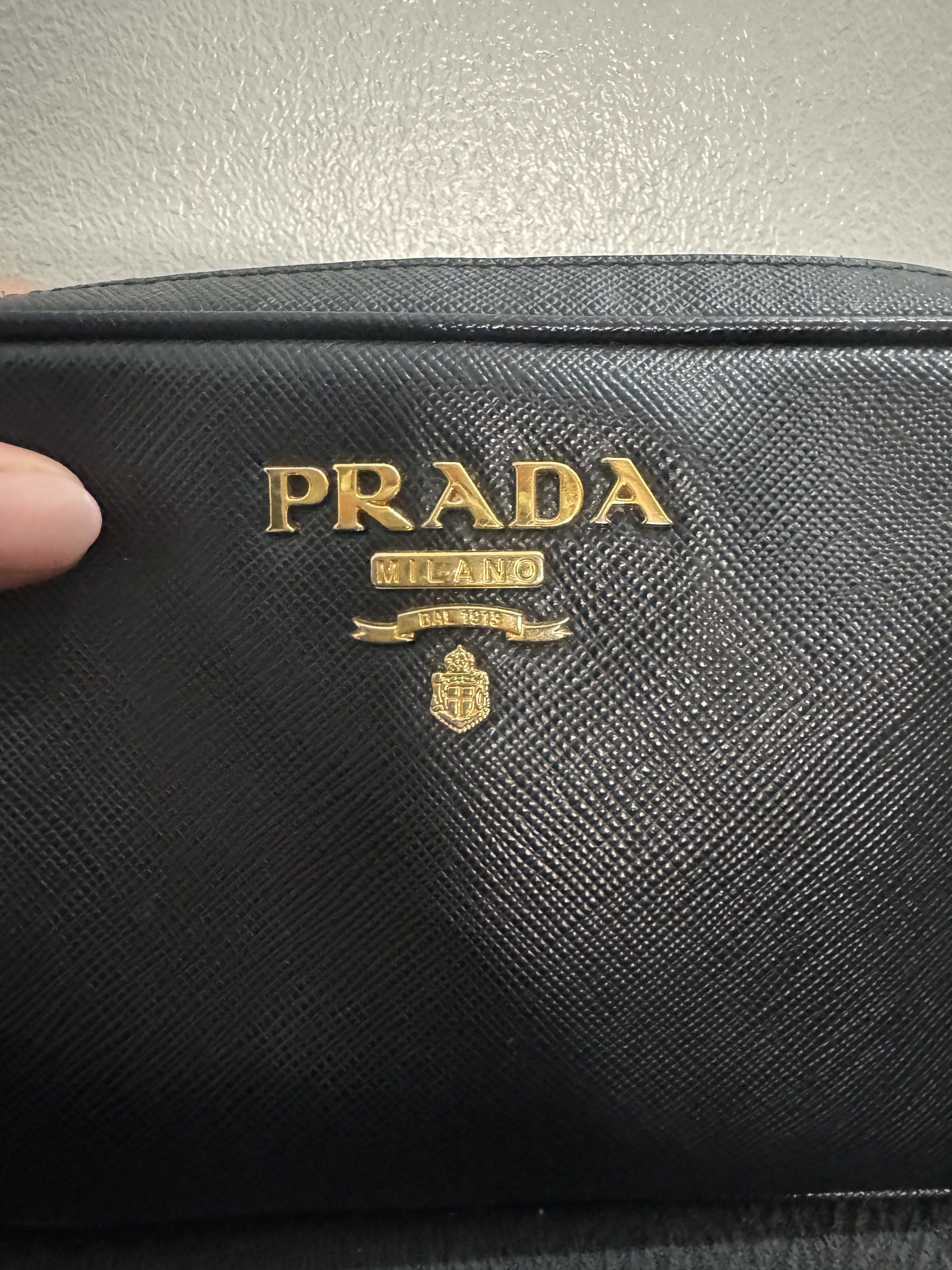 Prada Crossbody Bag (Category: Luxury Bags & Wallets) located in Manila. Submitted by missgrace_collection (Listing ID 1419594928, Image 2). Description: - Authentic Prada crossbody bag - Black color with card - Gold-tone hardware may signs of used po yung strap pls see photo.