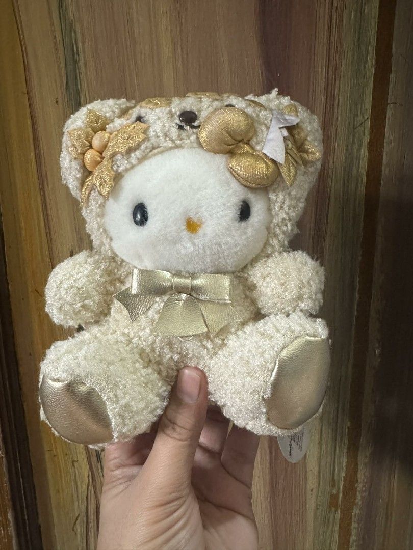 Rare Hello Kitty Golden Bear 2002 (Category: Vintage Collectibles) located in Caloocan City. Submitted by dyubella (Listing ID 1419659018, Image 1). Description: Hello Kitty Golden Angel Bear 2002 (Rare) Selling my authentic 2002 Sanrio Hello Kitty Golden Angel Bear. This is a hard-to-find (HTF) vintage piece, perfect for serious Sanrio collectors. Details: Golden wings, bear hood, and flower embroidery. Condition: Very Good vintage condition. Wi