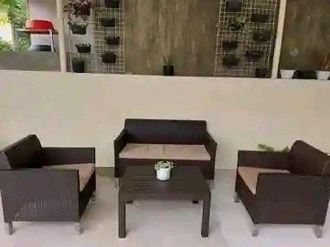 Rattan Outdoor Sofa Set with Glass Table (Category: Outdoor Furniture) located in Manila. Submitted by money-lyn (Listing ID 1419701851, Image 2). Description: Stylish rattan outdoor furniture set. Includes a two-seater sofa, two armchairs, and a coffee table with a glass top. The set features comfortable cushions and a dark brown woven design. Perfect for patios, balconies, or gardens. Provides a comfortable and inviting space for relaxation and