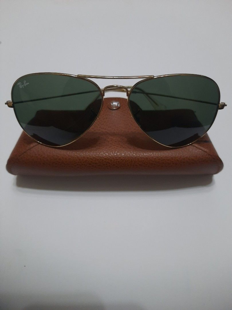 Ray-Ban / Lucky Star Sunglasses (Category: Sunglasses & Eyewear) located in Quezon City. Submitted by henco (Listing ID 1419726894, Image 2). Description: Ray-Ban clip-on sunglasses with gold frame. Includes green and brown lenses. Comes with a brown leather case. Made in Italy, and will include Lucky Star Sunglasses with frame marked "14K GP". pls. msg. or call 09279957180 for fast transactions..