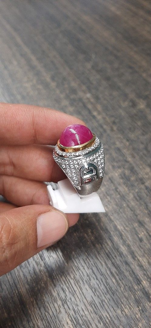 Ruby Gemstone Ring (Category: Rings) located in Singapore. Submitted by permataqolbu (Listing ID 1419746025, Image 3). Description: - Features a vibrant red ruby gemstone. - Silver band with intricate detailing. - Gold-colored setting..