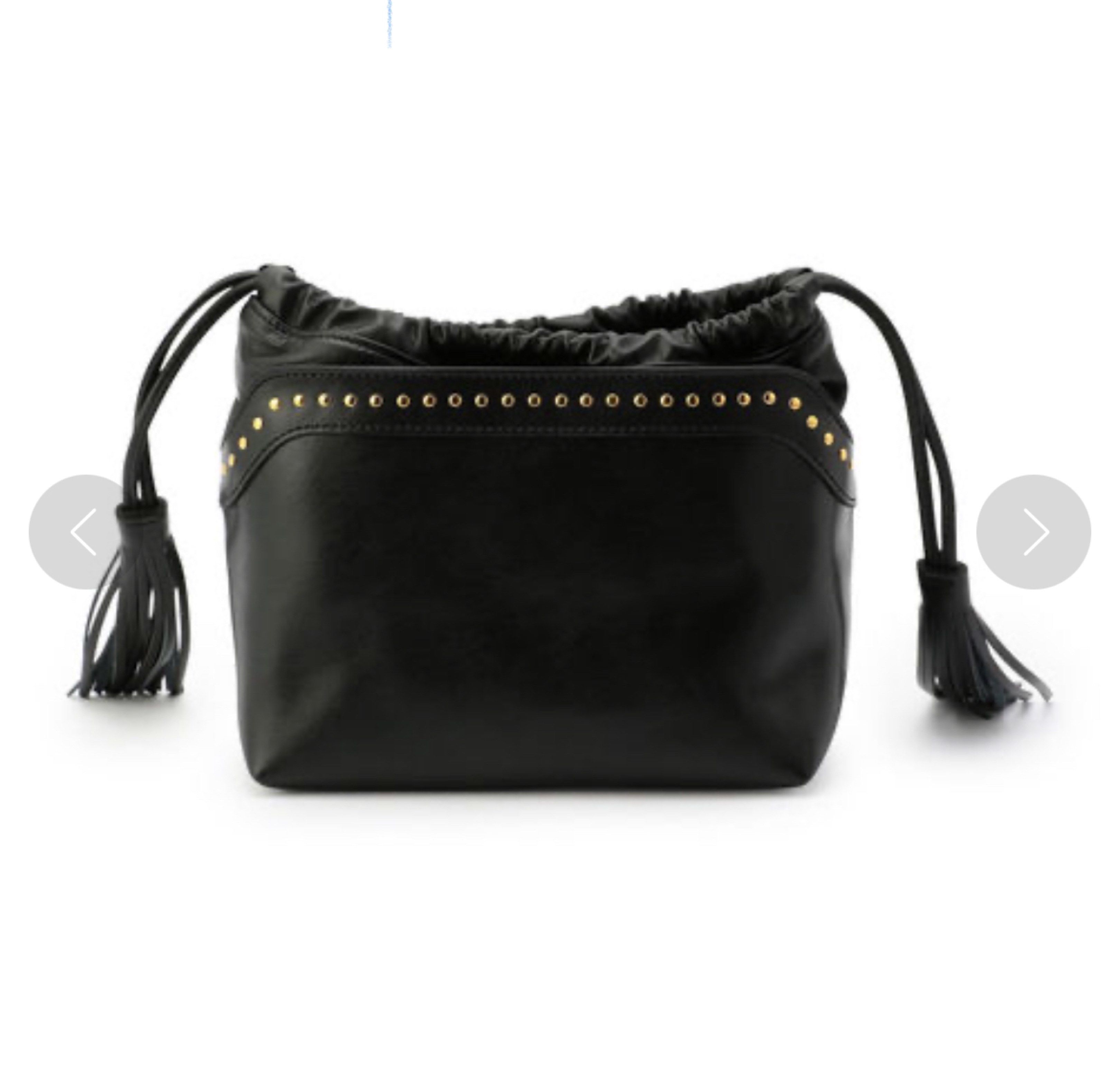 Samantha Vega Black Drawstring Handbag (Category: Luxury Bags & Wallets) located in Marikina City. Submitted by tresariascats (Listing ID 1419646709, Image 1). Description: - Samantha Vega black drawstring handbag - Gold stud details - Shoulder strap and tassel accents - Drawstring closure - Small interior pocket - Can be worn as a shoulder bag or carried by the handle.