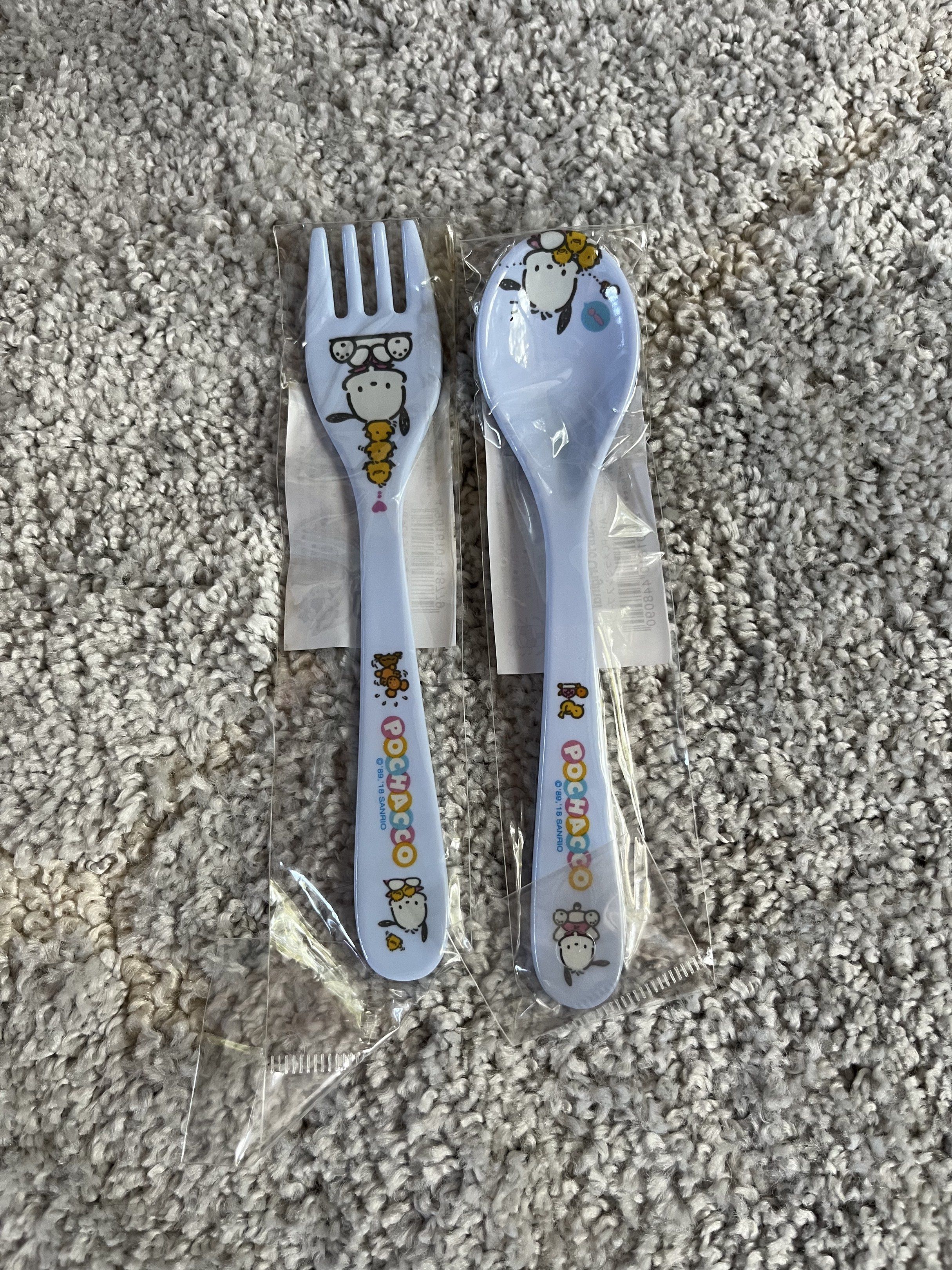 Sanrio Pochacco Spoon and Fork Set (Category: Dinnerware & Cutlery) located in Marikina City. Submitted by anythindahan (Listing ID 1419699603, Image 1). Description: 🍓original and bnew Sanrio Pochacco spoon and fork set from Japan - Includes one spoon and one fork. - Features a cute Pochacco design. - Color: Light blue. - Material: Melamine..
