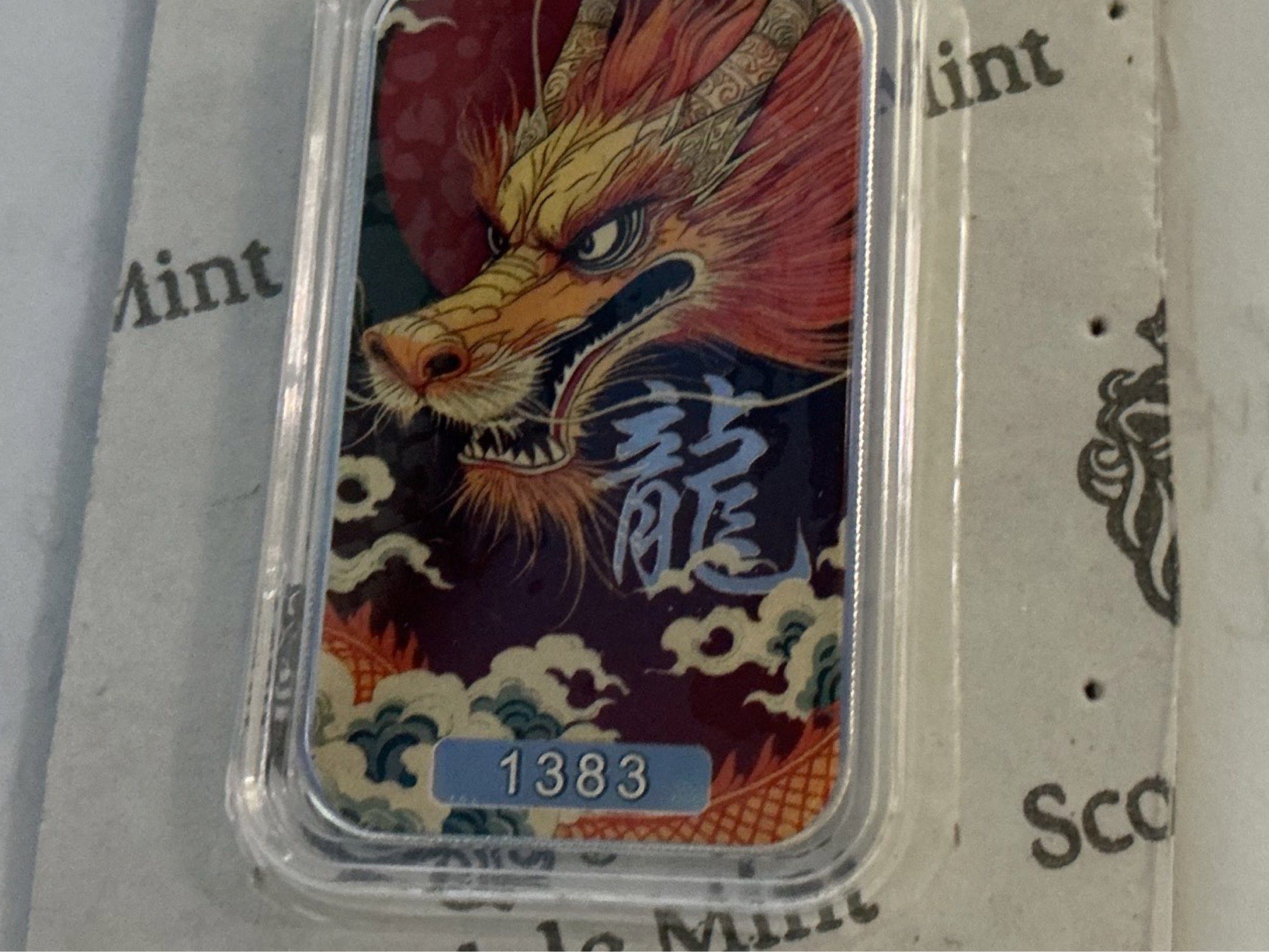 Scottsdale Mint Dragon Silver Bar #4/5 (Category: Currency) located in Del Monte. Submitted by bernapi63 (Listing ID 1419625630, Image 1). Description: - Scottsdale Mint silver bar 1 oz 999 fineness Silver “Kuangying Dragon “ no.4 of 5 Beautiful Dragons 4/5 - Features a detailed dragon design - Encased in a protective plastic case - Includes original packaging - Serial number: 1383 Serialized individual Dragon now. - Vibrant and colorful design.