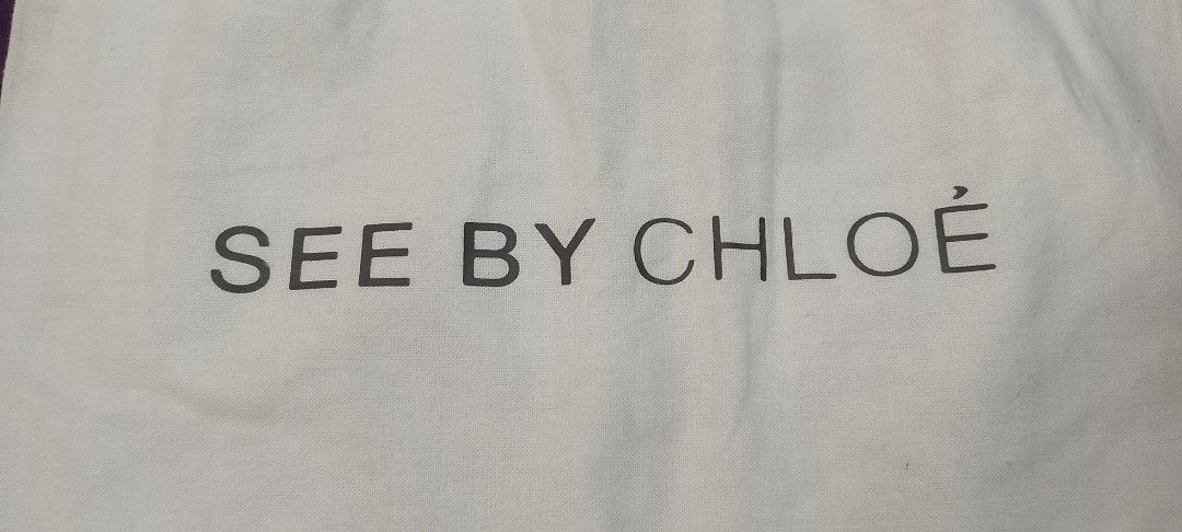See by Chloé Dust Bag (Category: Luxury Bags & Wallets) located in Cabanatuan. Submitted by miss.maia (Listing ID 1419761008, Image 2). Description: - Authentic See by Chloé dust bag - White fabric - Black brand logo - Drawstring closure with pink cords - Approximately 11 inches in length - Perfect for protecting your See by Chloé bag.