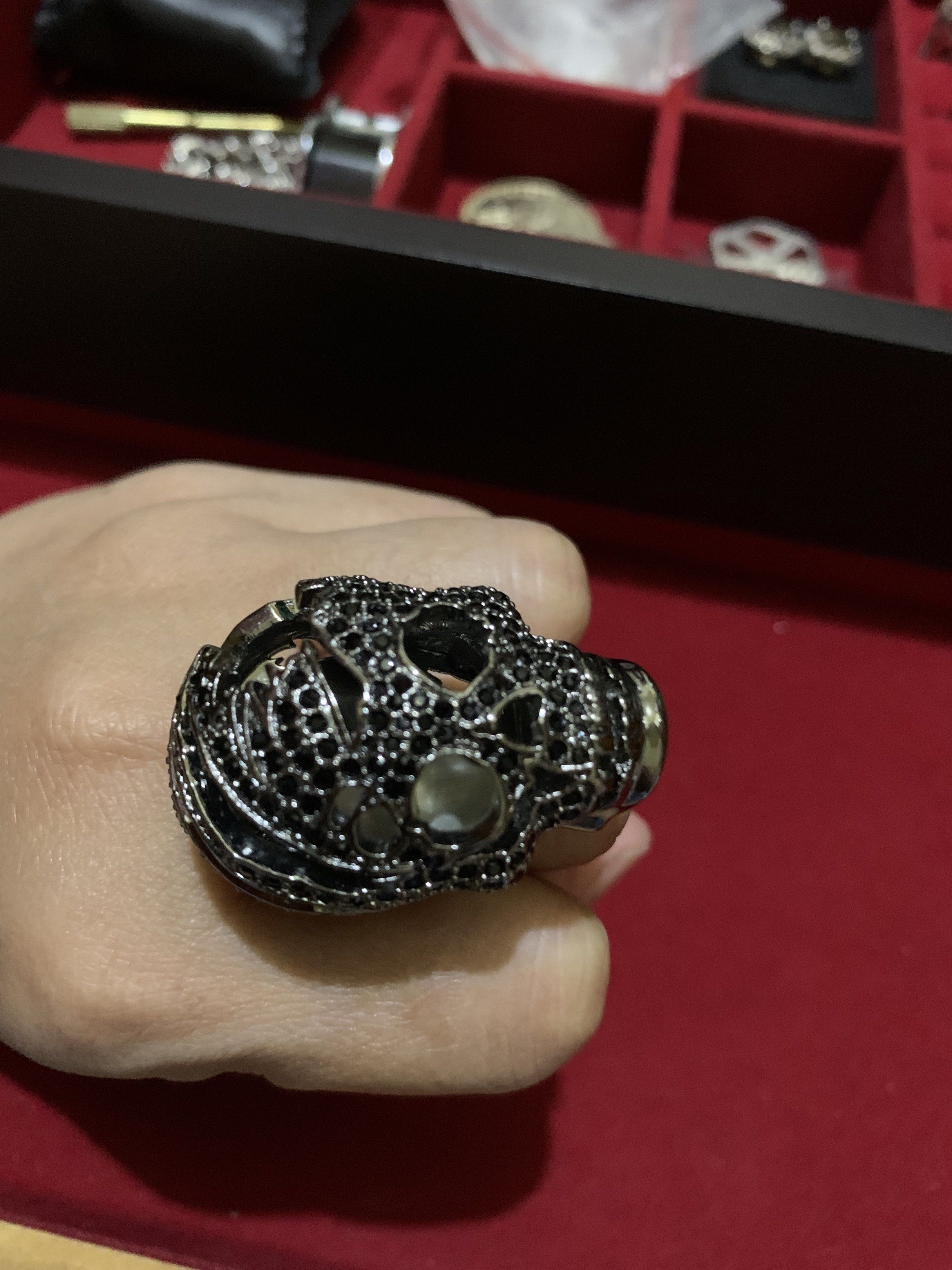 Skull Ring with Black Stones (Category: Rings) located in Quezon City. Submitted by ncjnc (Listing ID 1419713542, Image 2). Description: - Unique skull ring - Intricate detailing - Features black stones - Dark metallic finish - Simple, polished band - Statement piece.