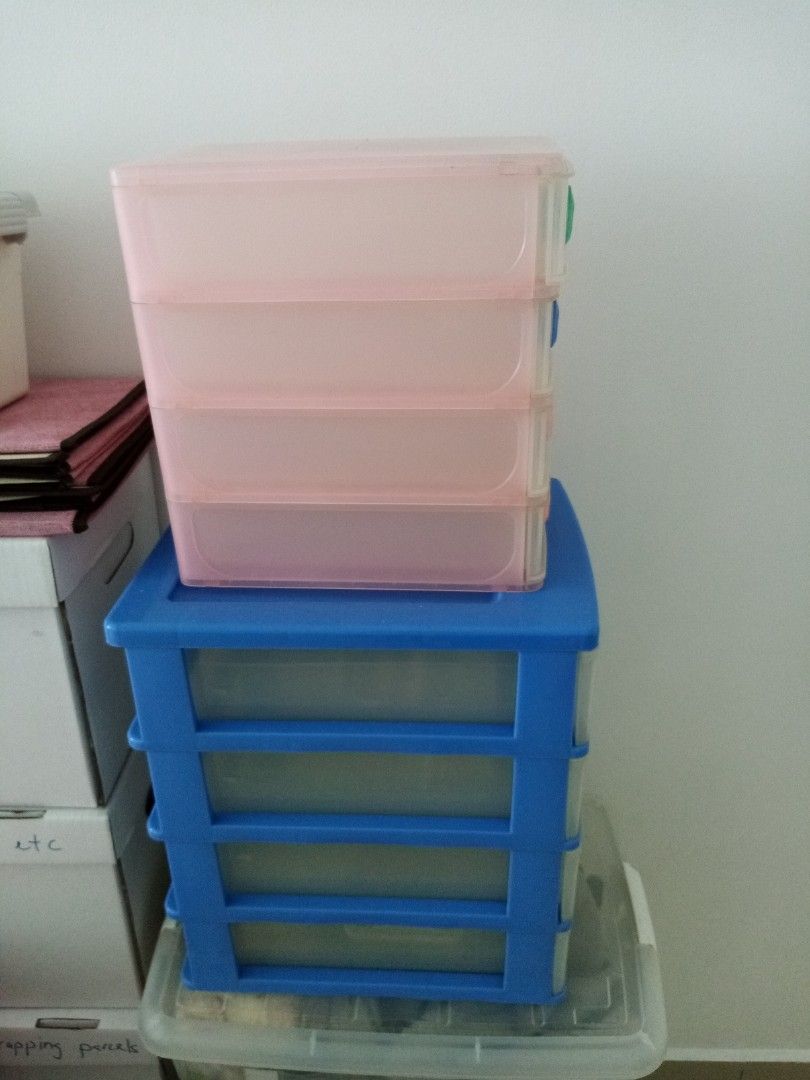 Stackable Plastic Storage Drawers (Category: Shelves, Cabinets & Racks) located in Johor Bahru. Submitted by dora9_9 (Listing ID 1419611228, Image 2). Description: - Stackable plastic storage drawers - Clear drawers for easy content visibility - Colorful handles - Bunny stickers on top drawers - Blue base, pink top drawers - Ideal for organizing small items.