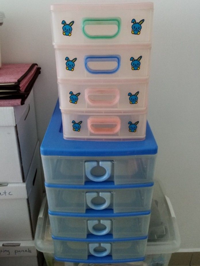 Stackable Plastic Storage Drawers (Category: Shelves, Cabinets & Racks) located in Johor Bahru. Submitted by dora9_9 (Listing ID 1419611228, Image 1). Description: - Stackable plastic storage drawers - Clear drawers for easy content visibility - Colorful handles - Bunny stickers on top drawers - Blue base, pink top drawers - Ideal for organizing small items.