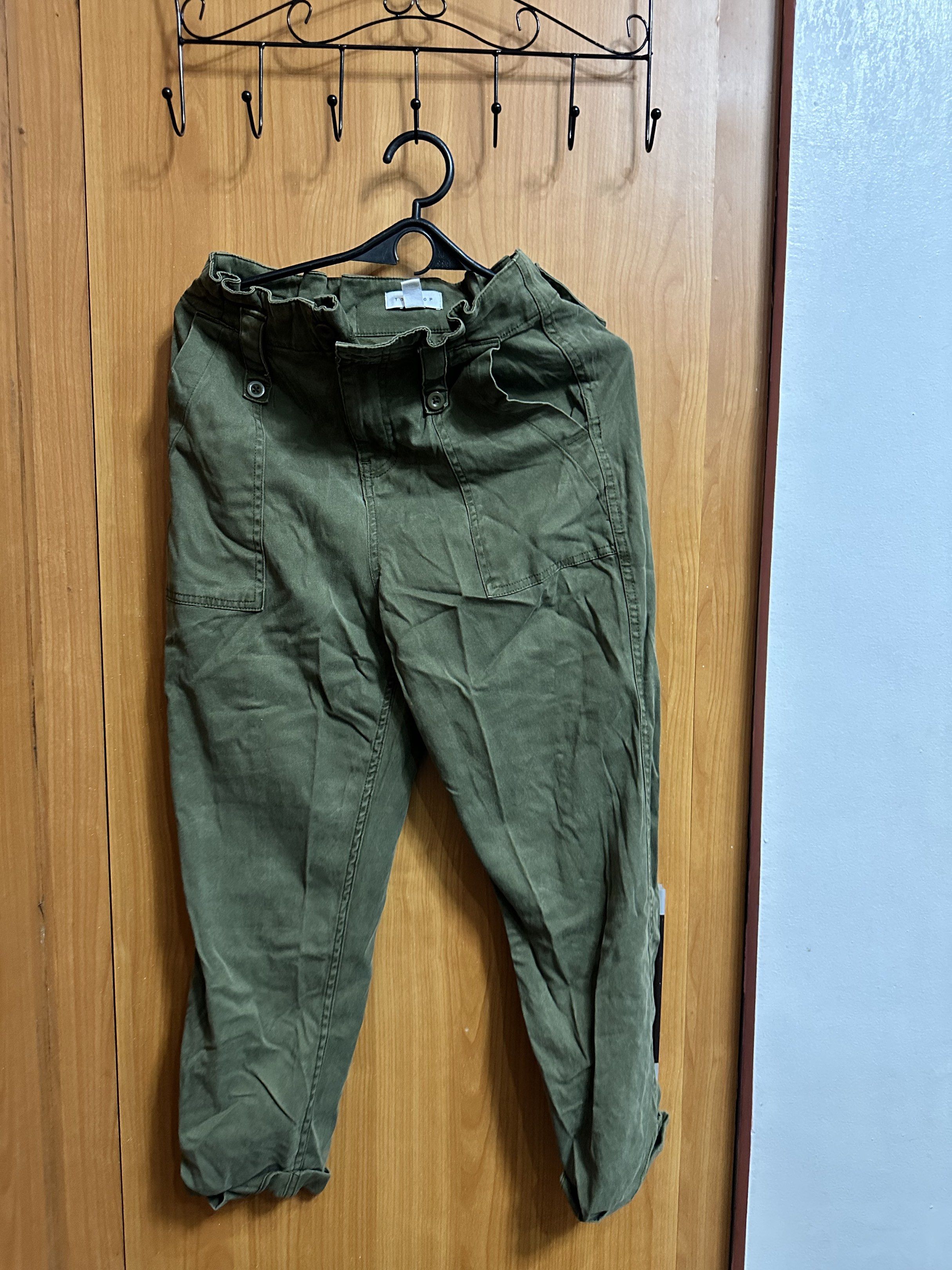Topshop Petite Green Pants (Category: Other Bottoms) located in Manila. Submitted by _lovedbyurstrully (Listing ID 1419627163, Image 1). Description: - Topshop Petite pants - Size: UK 8 / EUR 36 - Color: Muted green - Features: Gathered waist, button closure, pockets - Made in the Philippines.