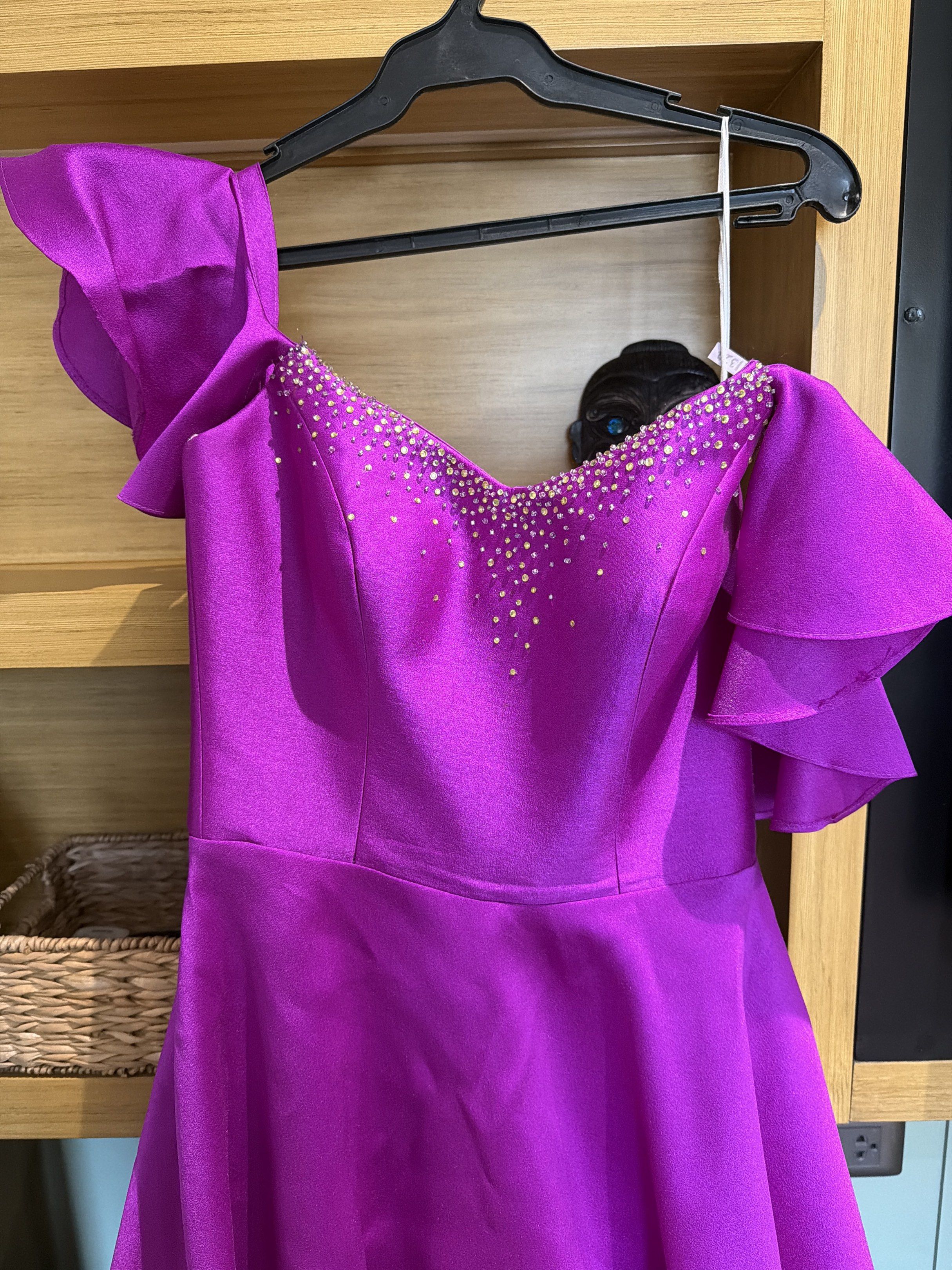 Vee Tan One-Shoulder Gown with slit (gazaar) (Category: Evening dresses & gowns) located in San Juan City. Submitted by closetsale28 (Listing ID 1419613434, Image 2). Description: - Vee Tan one-shoulder gown - Vibrant purple color - Flowing silhouette - Delicate bodice embellishments - Cascading shoulder ruffles - Concealed zipper closure - Perfect for formal events and special occasions.