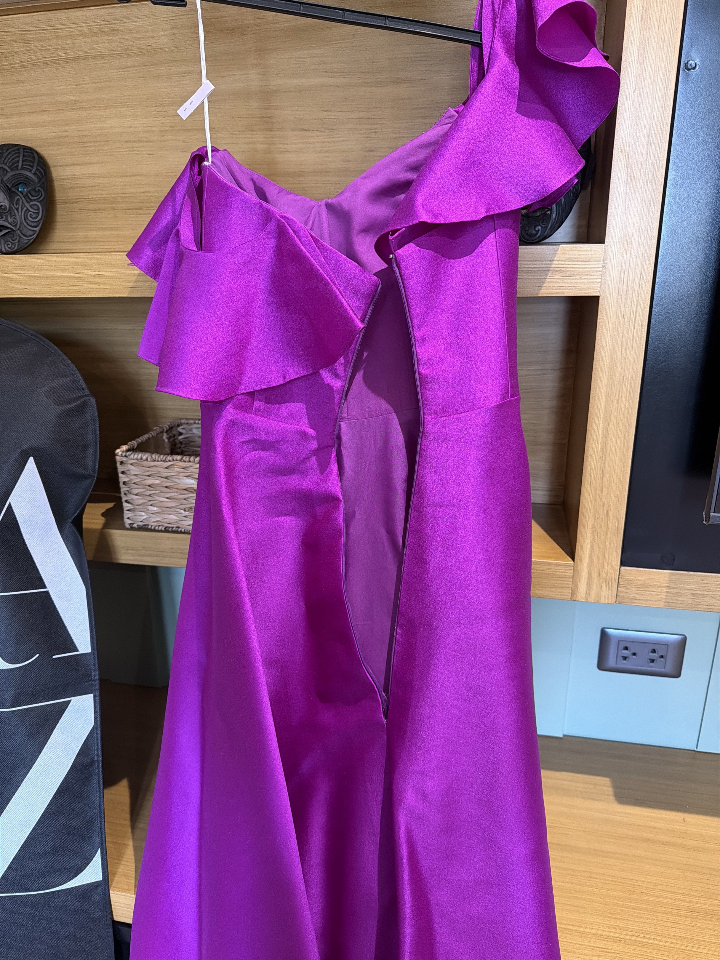Vee Tan One-Shoulder Gown with slit (gazaar) (Category: Evening dresses & gowns) located in San Juan City. Submitted by closetsale28 (Listing ID 1419613434, Image 3). Description: - Vee Tan one-shoulder gown - Vibrant purple color - Flowing silhouette - Delicate bodice embellishments - Cascading shoulder ruffles - Concealed zipper closure - Perfect for formal events and special occasions.