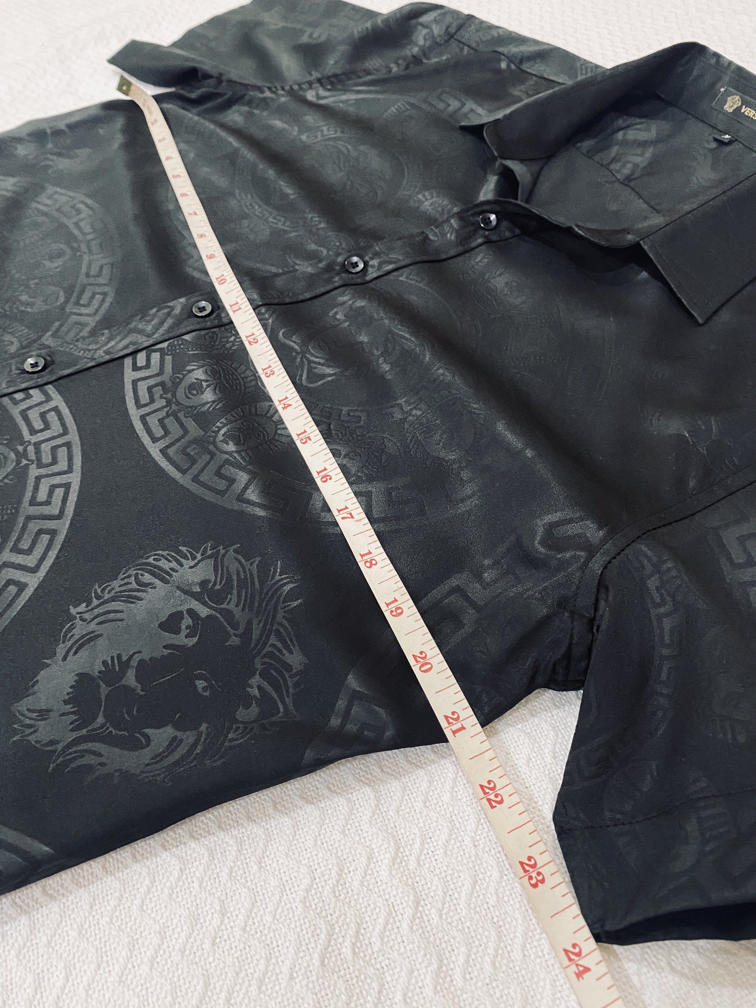 Versace Black Short Sleeve Shirt (Category: Tshirts & Polo Shirts ) located in Morong. Submitted by aa.vinmy (Listing ID 1419603865, Image 3). Description: Versace short sleeve shirt. Size M. Black with subtle pattern and logo. Silky material..