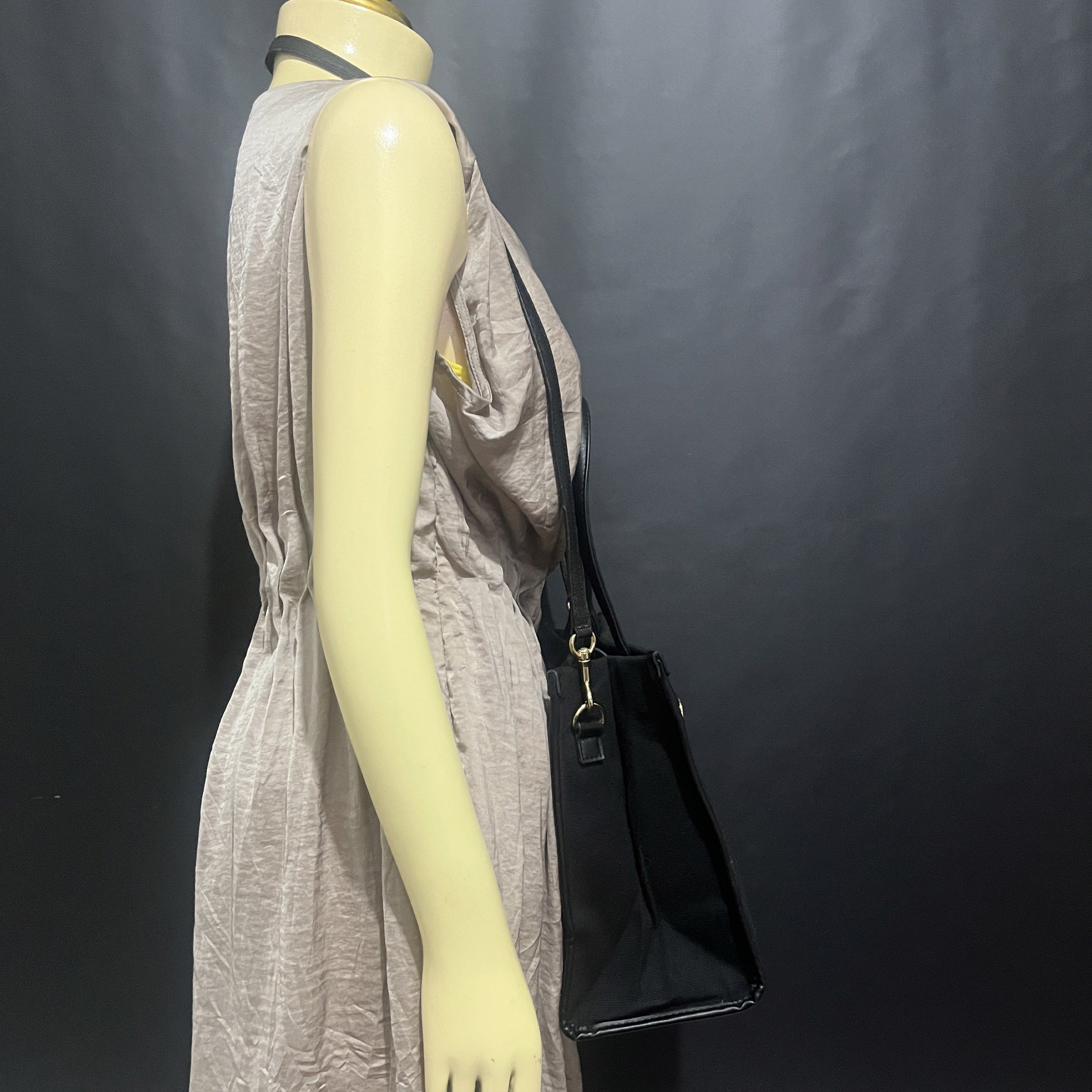 Versace Black Tote Bag with Shoulder Strap (Category: Luxury Bags & Wallets) located in Butuan. Submitted by dfgthriftology2.0 (Listing ID 1419721066, Image 3). Description: - Versace tote bag - Black canvas and leather exterior - Gold Greek key design - Detachable shoulder strap - Top handles - Rectangular shape - Black interior lining - Versace logo on front - Small interior pocket.