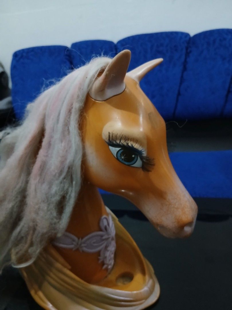 Vintage Carousel Horse Head (Category: Vintage Collectibles) located in Koronadal. Submitted by madison.jbote (Listing ID 1419693302, Image 2). Description: - Vintage carousel horse head - Light brown color - Detailed facial features - Large eyes with long eyelashes - Pink mane - Decorative neck element - Made of durable material - Unique decorative piece.