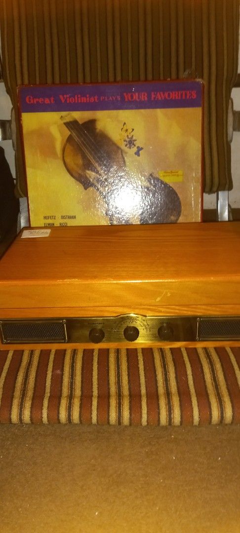 Vintage Record Player with Built-in Speakers (Category: Portable Music Players) located in Manila. Submitted by richardlee51903 (Listing ID 1419756989, Image 3). Description: - Vintage record player - Wooden cabinet - Built-in speakers - Turntable and tonearm included - Volume and other controls - Subwoofer line out - DC 9V input - Includes a record album - Perfect for listening to vinyl records.