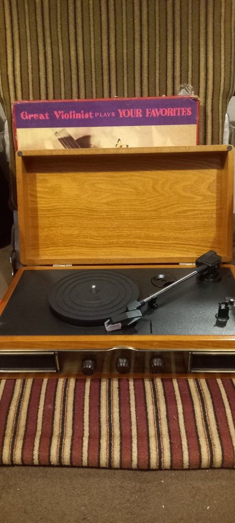 Vintage Record Player with Built-in Speakers (Category: Portable Music Players) located in Manila. Submitted by richardlee51903 (Listing ID 1419756989, Image 1). Description: - Vintage record player - Wooden cabinet - Built-in speakers - Turntable and tonearm included - Volume and other controls - Subwoofer line out - DC 9V input - Includes a record album - Perfect for listening to vinyl records.