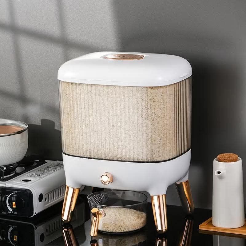 White and Gold Rice Dispenser (Category: Food Organization & Storage) located in Manila. Submitted by yzlshop (Listing ID 1419673938, Image 1). Description: - Stylish white and gold rice dispenser - Clear container for easy rice level viewing - Includes a dispensing mechanism - Comes with a small measuring cup - Elevated on elegant gold-colored legs - Modern and functional kitchen accessory.