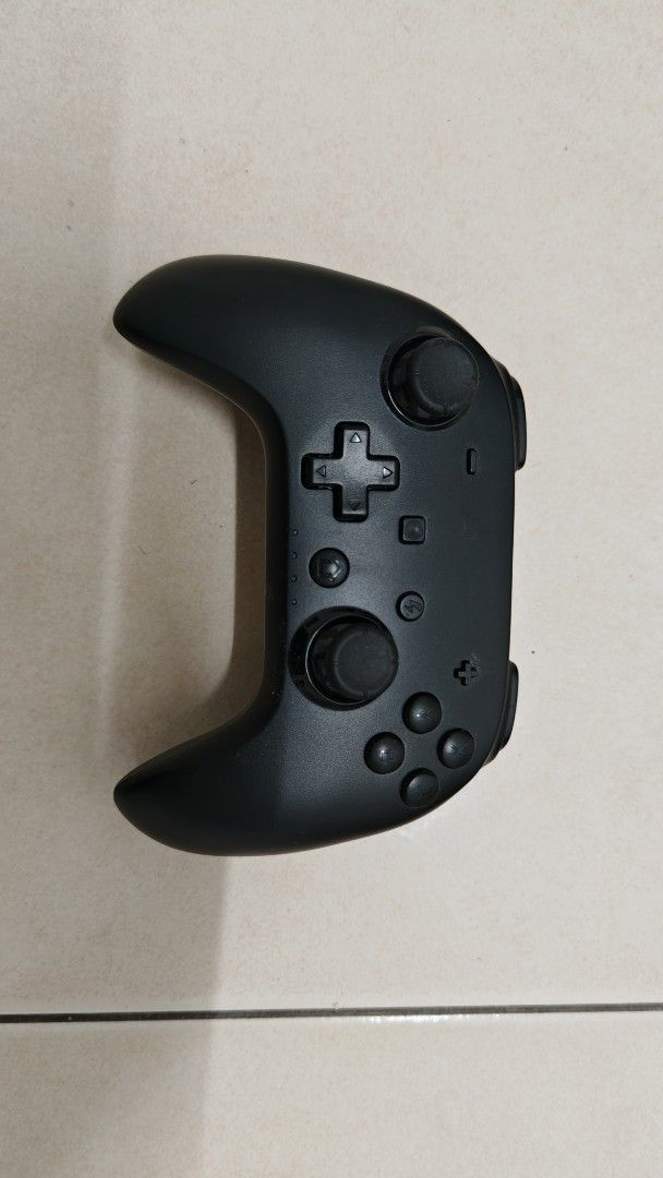 Wireless Controller (Category: Controllers) located in Sungai Buloh. Submitted by shirou99 (Listing ID 1419597347, Image 1). Description: - Wireless gaming controller - Black color - Standard button layout (directional pad, analog sticks, action buttons) - Features a charging port - Additional function buttons on the back - Designed for comfortable handling -This is specially made for IOS (Iphone, mac, ipad, etc) -Android cannot connect. -Window 