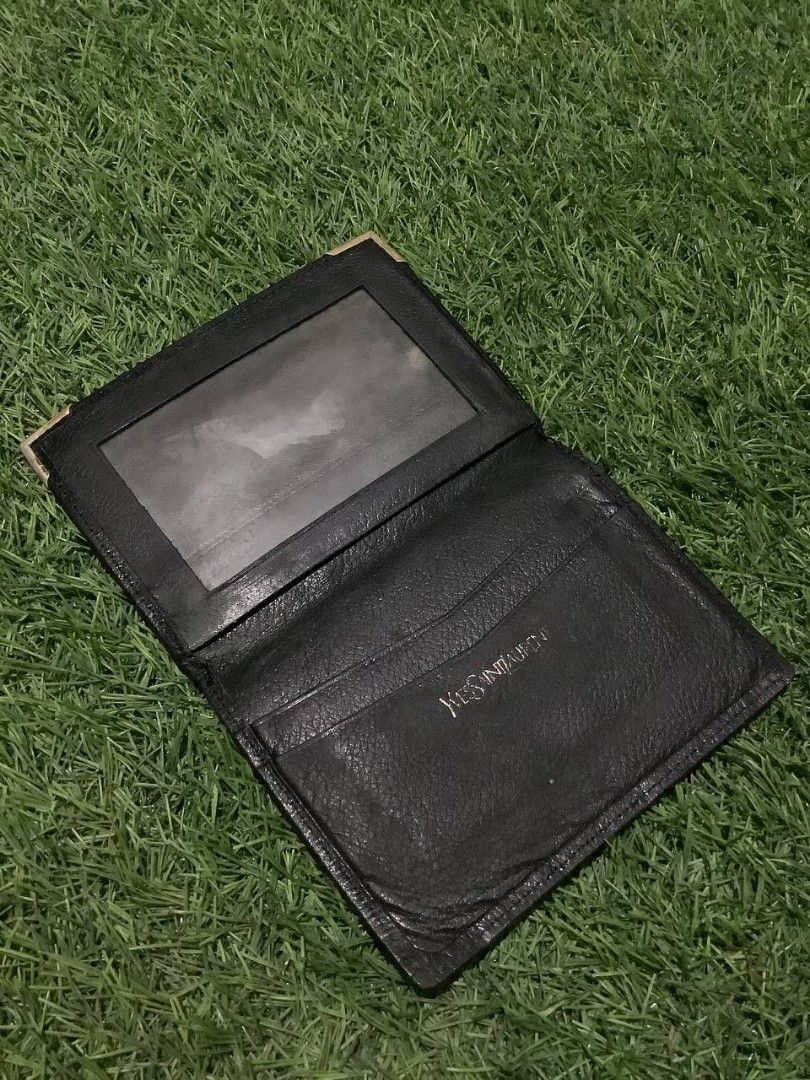 Yves Saint Laurent Card Holder (Category: Luxury Bags & Wallets) located in Nabua. Submitted by stayhypethrifted (Listing ID 1419778831, Image 2). Description: - Authentic YSL card holder - Features the YSL logo - Multiple card slots - Clear ID window - Silver-colored corner accents - Black interior with embossed YSL logo.
