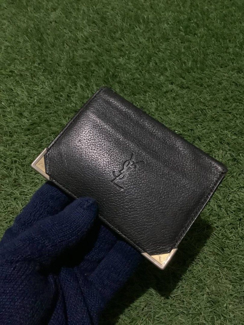 Yves Saint Laurent Card Holder (Category: Luxury Bags & Wallets) located in Nabua. Submitted by stayhypethrifted (Listing ID 1419778831, Image 3). Description: - Authentic YSL card holder - Features the YSL logo - Multiple card slots - Clear ID window - Silver-colored corner accents - Black interior with embossed YSL logo.