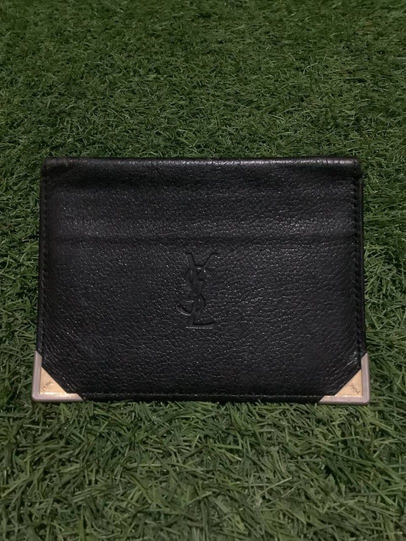 Yves Saint Laurent Card Holder (Category: Luxury Bags & Wallets) located in Nabua. Submitted by stayhypethrifted (Listing ID 1419778831, Image 1). Description: - Authentic YSL card holder - Features the YSL logo - Multiple card slots - Clear ID window - Silver-colored corner accents - Black interior with embossed YSL logo.