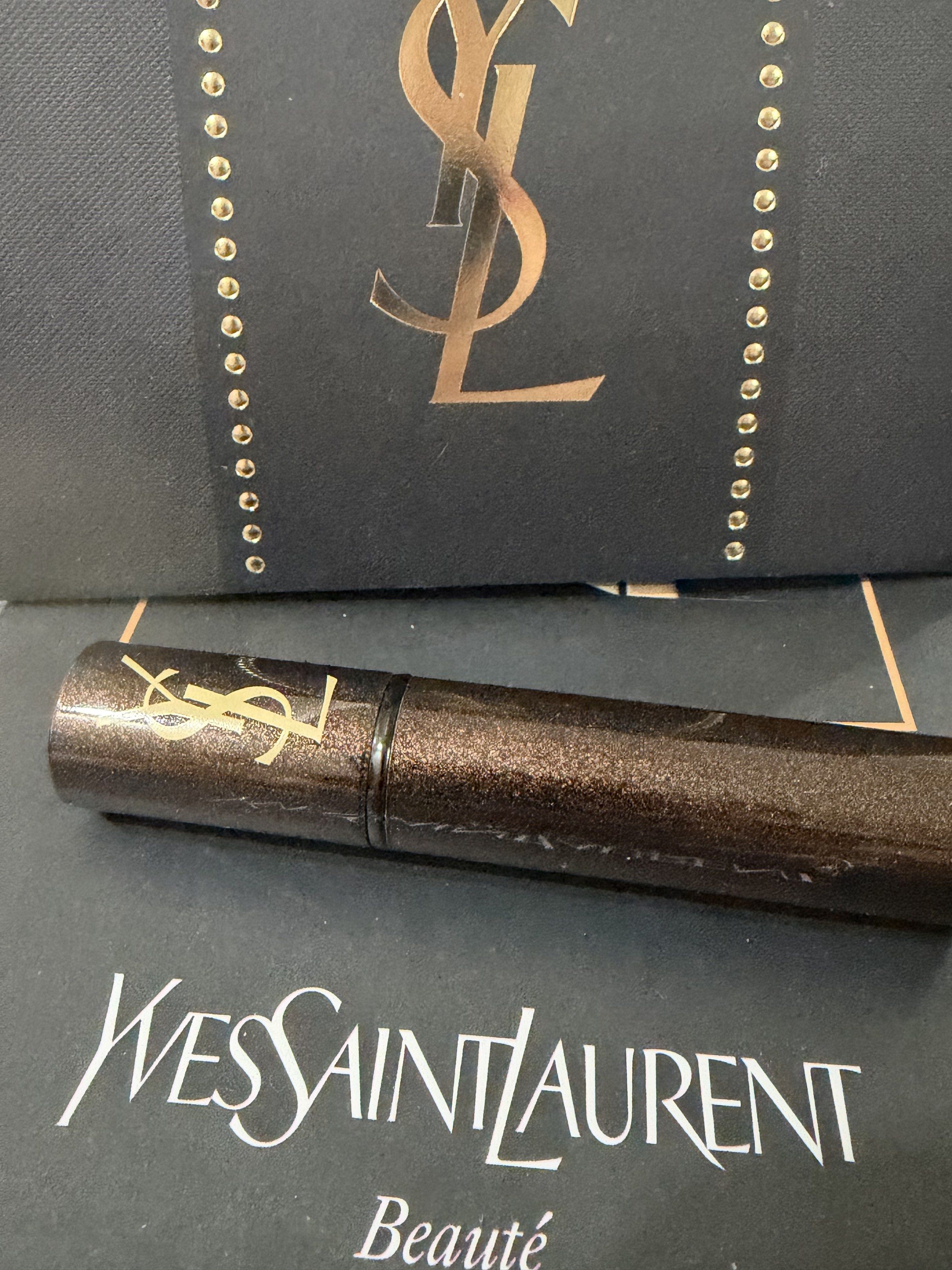 Yves Saint Laurent Retractable Brush (Category: Makeup) located in Davao. Submitted by gr8stmom_melissa (Listing ID 1419627901, Image 3). Description: - Yves Saint Laurent retractable makeup brush - Features a metallic brown handle - Black brush head - Authentic YSL logo visible - Comes with a protective cap.