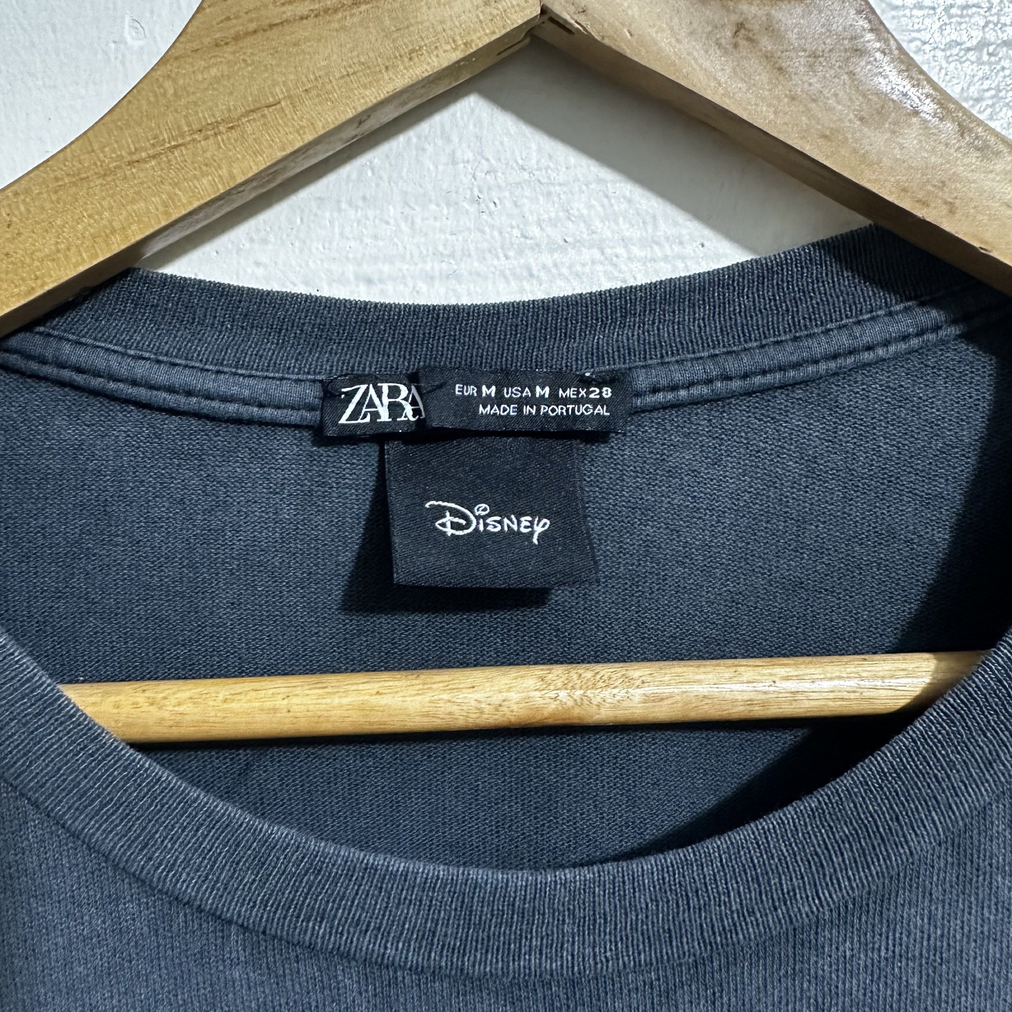 Zara Disney Daisy Duck Graphic Tee (Category: Shirts) located in Angeles City. Submitted by eemps (Listing ID 1419657088, Image 2). Description: - Size: L-XL (Women size) - Color: Dark grey - Crew neck, short sleeves .