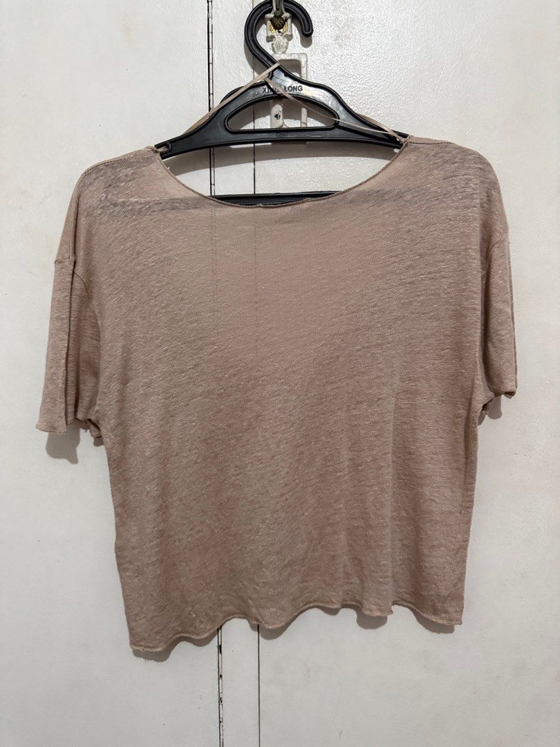 Zara scoop neck linen top (Category: Blouses) located in Malabon City. Submitted by decluttergyal (Listing ID 1419725092, Image 2). Description: - Zara top - Size: S - Color: Beige - Features: Scoop neck, short sleeves, relaxed fit - Details: Made in Portugal, wavy hemline - Never worn, only stored in the closet - Fabric is kinda see through best worn with inner top .