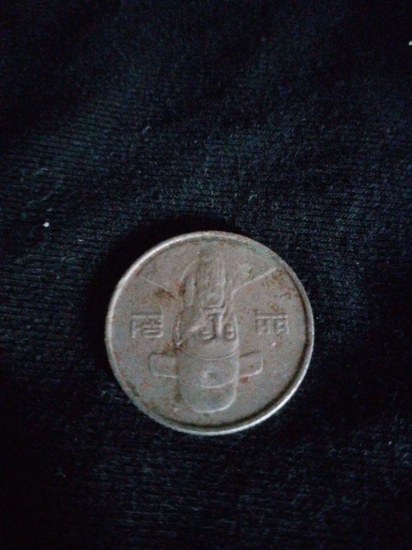 1987 100 Won Coin (Category: Currency) located in Pagbilao. Submitted by baldhousehusband (Listing ID 1419804238, Image 2). Description: - 1987 100 Won Coin - Features the number "100" - Includes an image on the other side - Made of metal.
