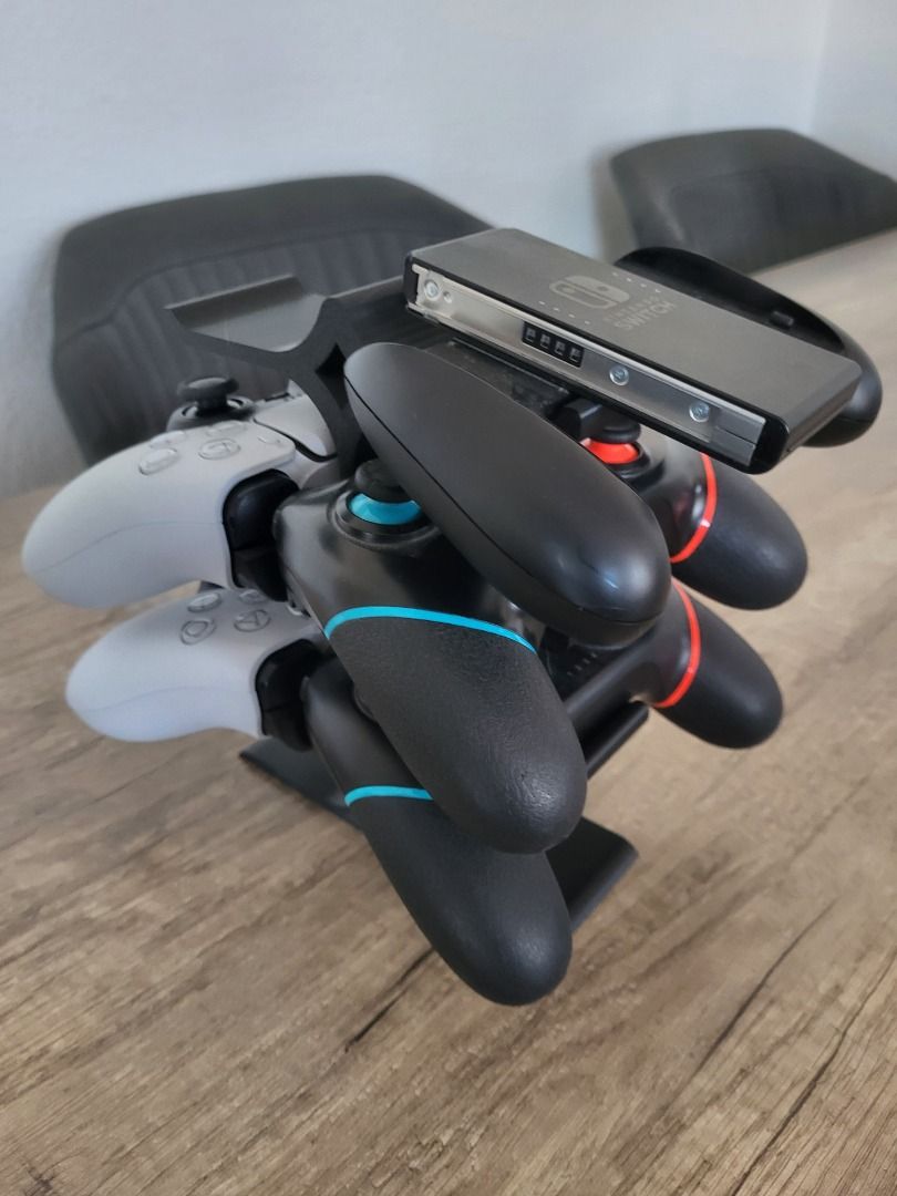 4‑Slot Universal Controller Stand – PS5/PS4/Xbox/Switch (Category: Cases & Covers) located in Mandaluyong City. Submitted by heyitslaaaance (Listing ID 1419828827, Image 1). Description: Say goodbye to clutter with this Multi‑Controller Tower Stand, designed to hold up to 4 controllers securely while keeping your gaming setup clean and stylish. 🔹 Fits All Major Controllers PS5 DualSense PS4 DualShock Xbox Controllers Nintendo Switch Pro Controll