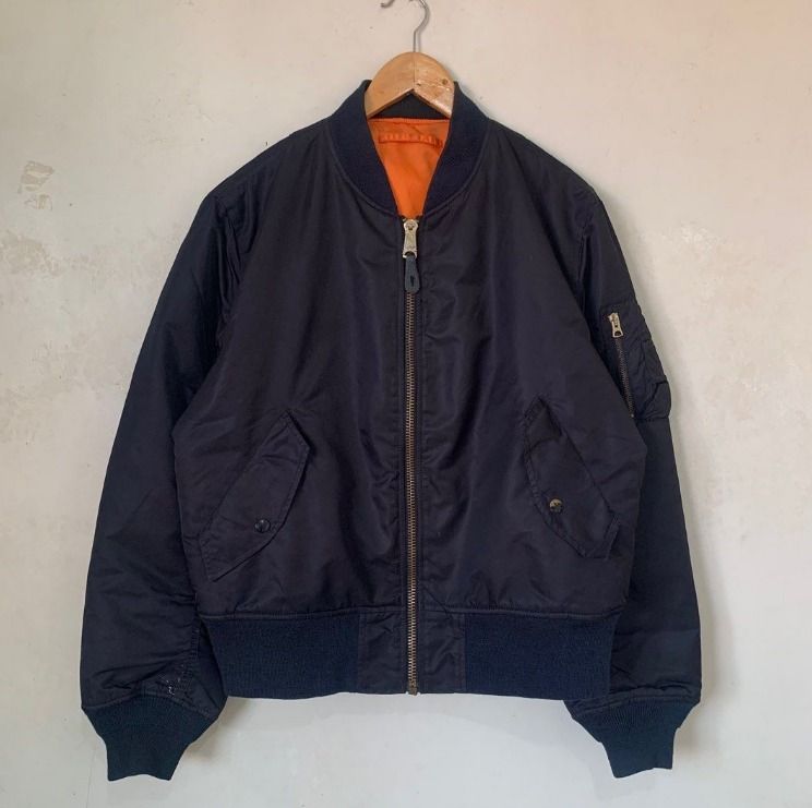Alpha Industries MA-1 Bomber Jacket (Category: Coats, Jackets and Outerwear) located in Quezon. Submitted by joooles (Listing ID 1419882111, Image 1). Description: - Alpha Industries MA-1 bomber jacket - Black exterior - Reversible orange lining - Zip closure - Two front pockets with snap closures - Utility pocket on left sleeve - Ribbed cuffs, collar, and hem - Stylish and functional outerwear.