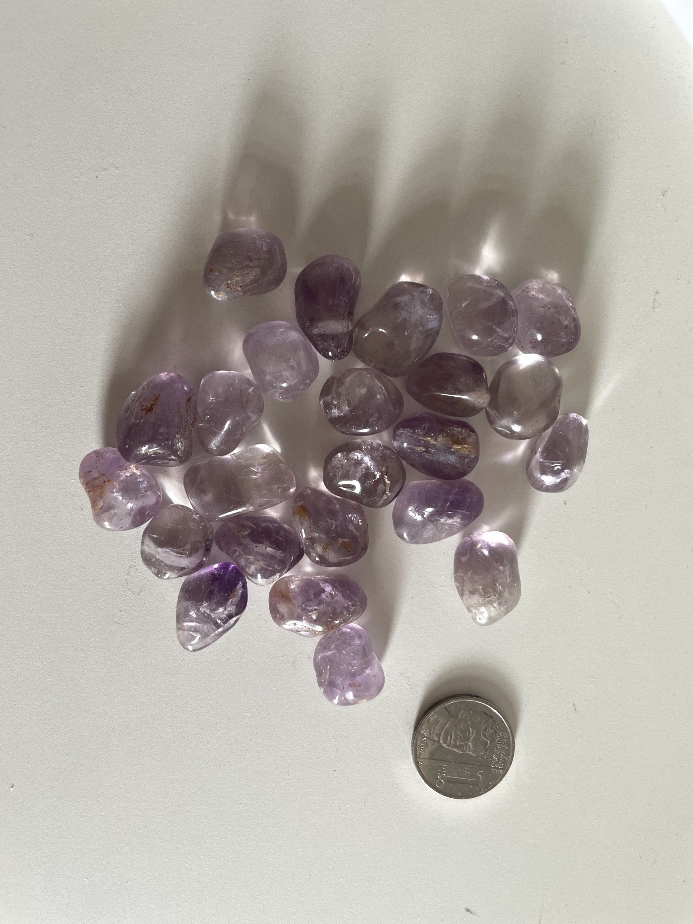 Amethyst Tumbled Stones (Category: Precious Stones) located in Cebu City. Submitted by jayejayejayejaye (Listing ID 1419802609, Image 1). Description: Brazilian Amethyst Tumbled Stones – Natural Crystal Authentic amethyst from Brazil with soft lavender to medium-purple tones. Smooth, polished, and perfect for crystal bowls, crafts, jewelry making, gifting, or spiritual use. Each piece is natural and unique with slight inclusions and color variati